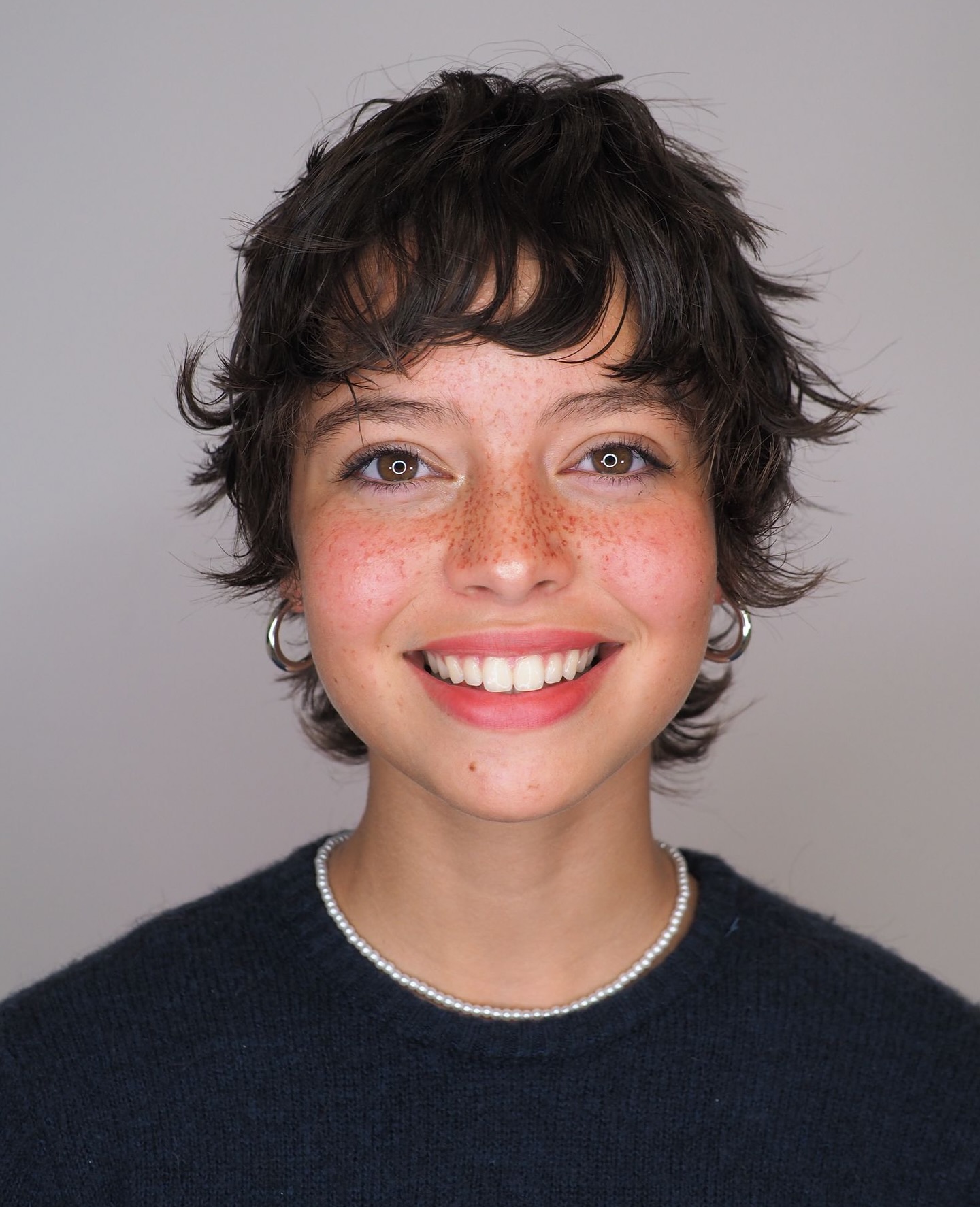 Playful Textured Pixie Cut with Soft Bangs