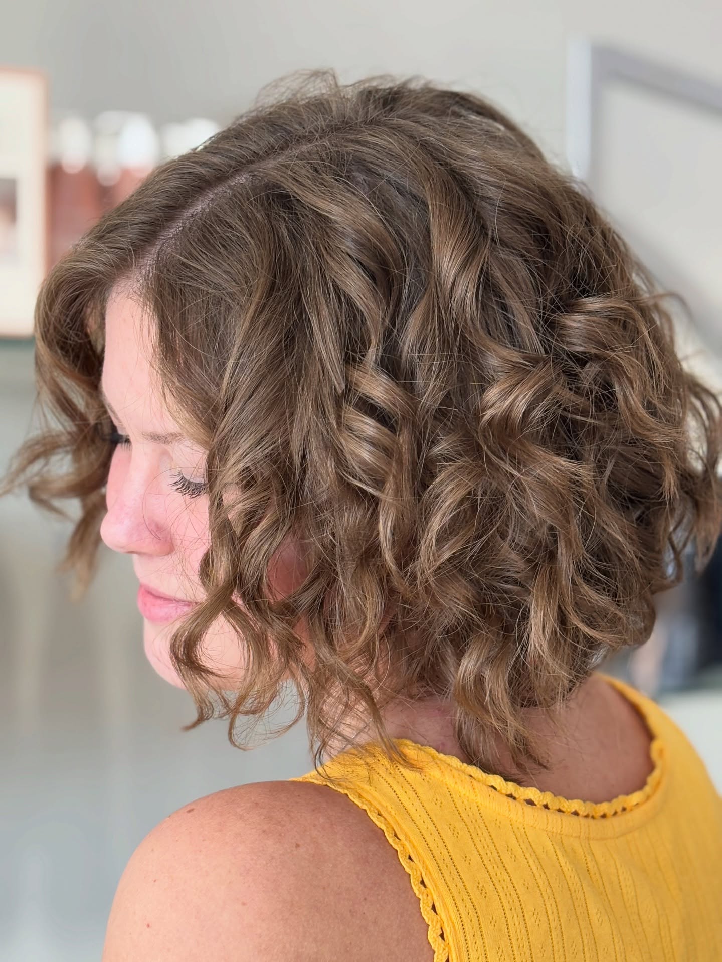 Short Curly Tousled Bob with Natural Tone Highlights