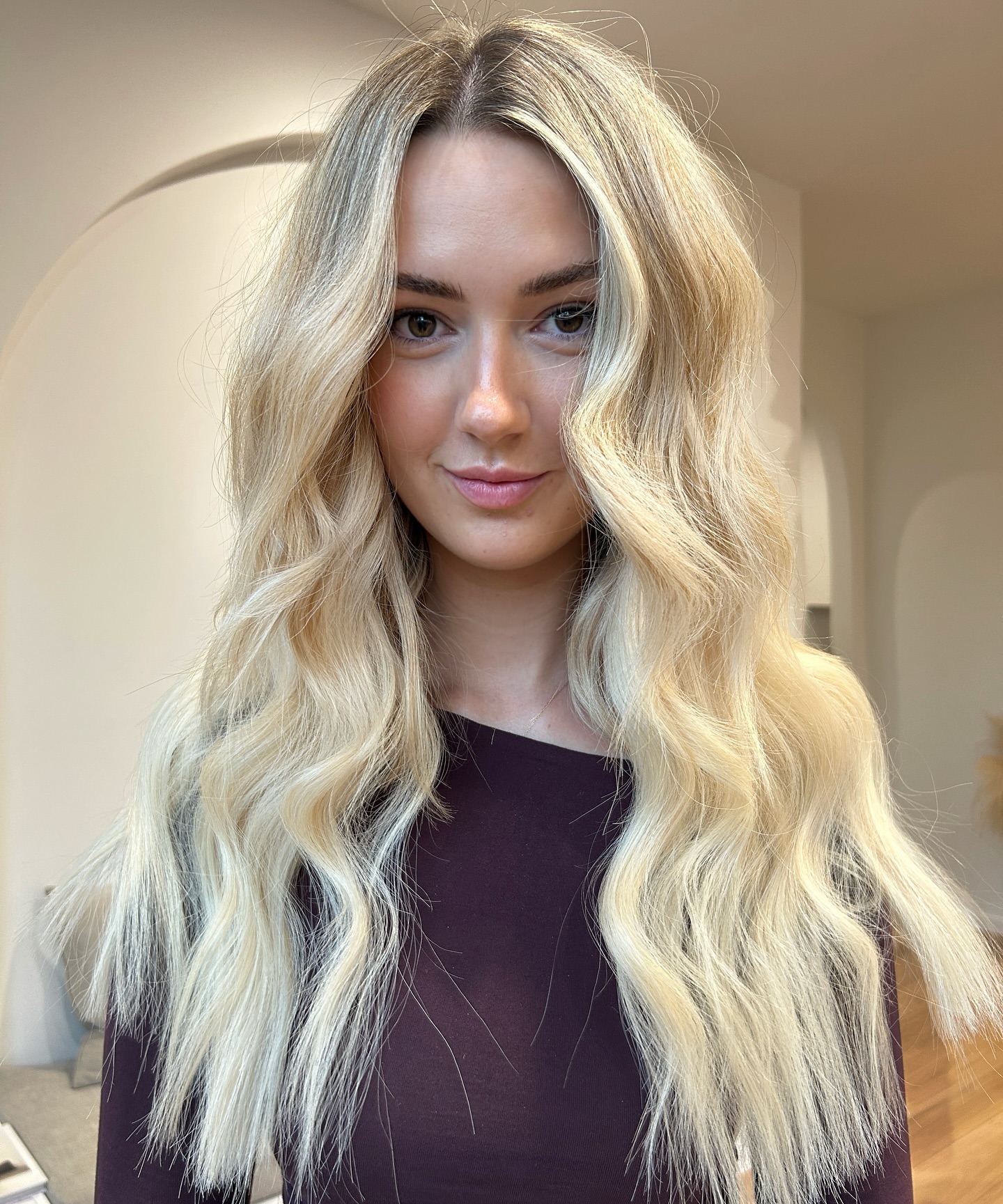 Soft Blonde Waves with Face-Framing Highlights