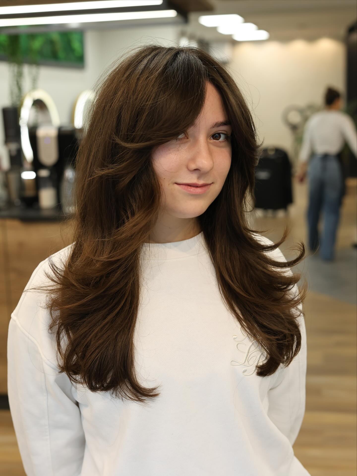 Softly Layered Butterfly Cut with Elegant Face-Frame