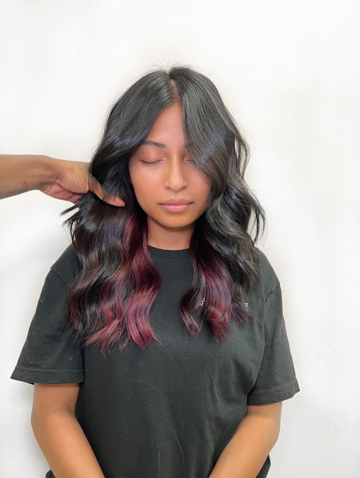 Textured Wavy Hair with Bold Magenta Highlights
