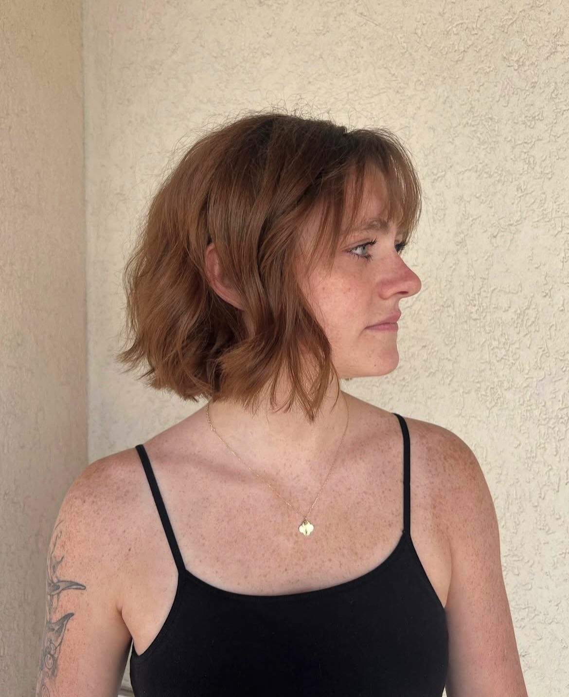 Textured Wispy Bangs with Soft, Curly Layers