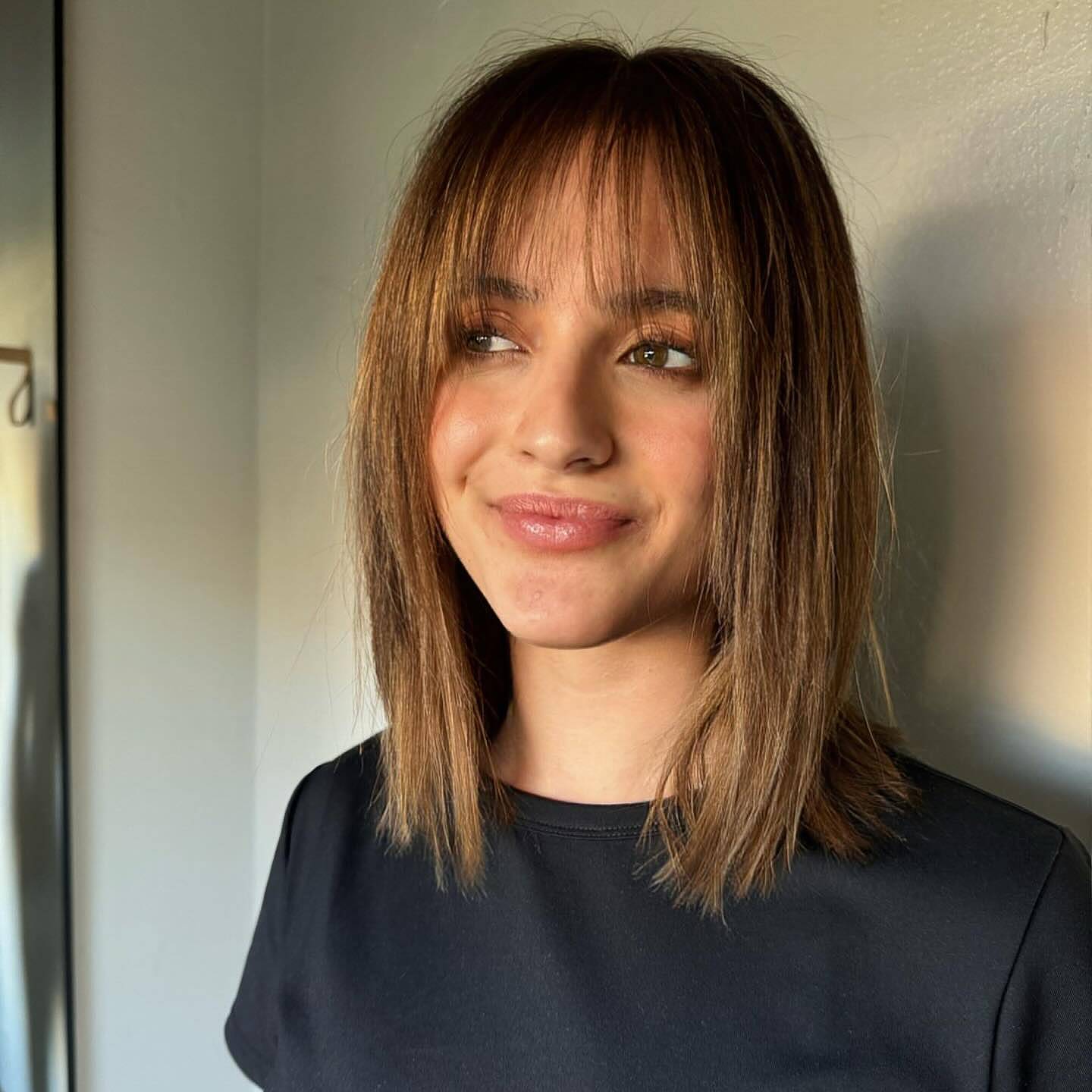 Textured Wispy Bangs with Subtle Layers for Thin Hair