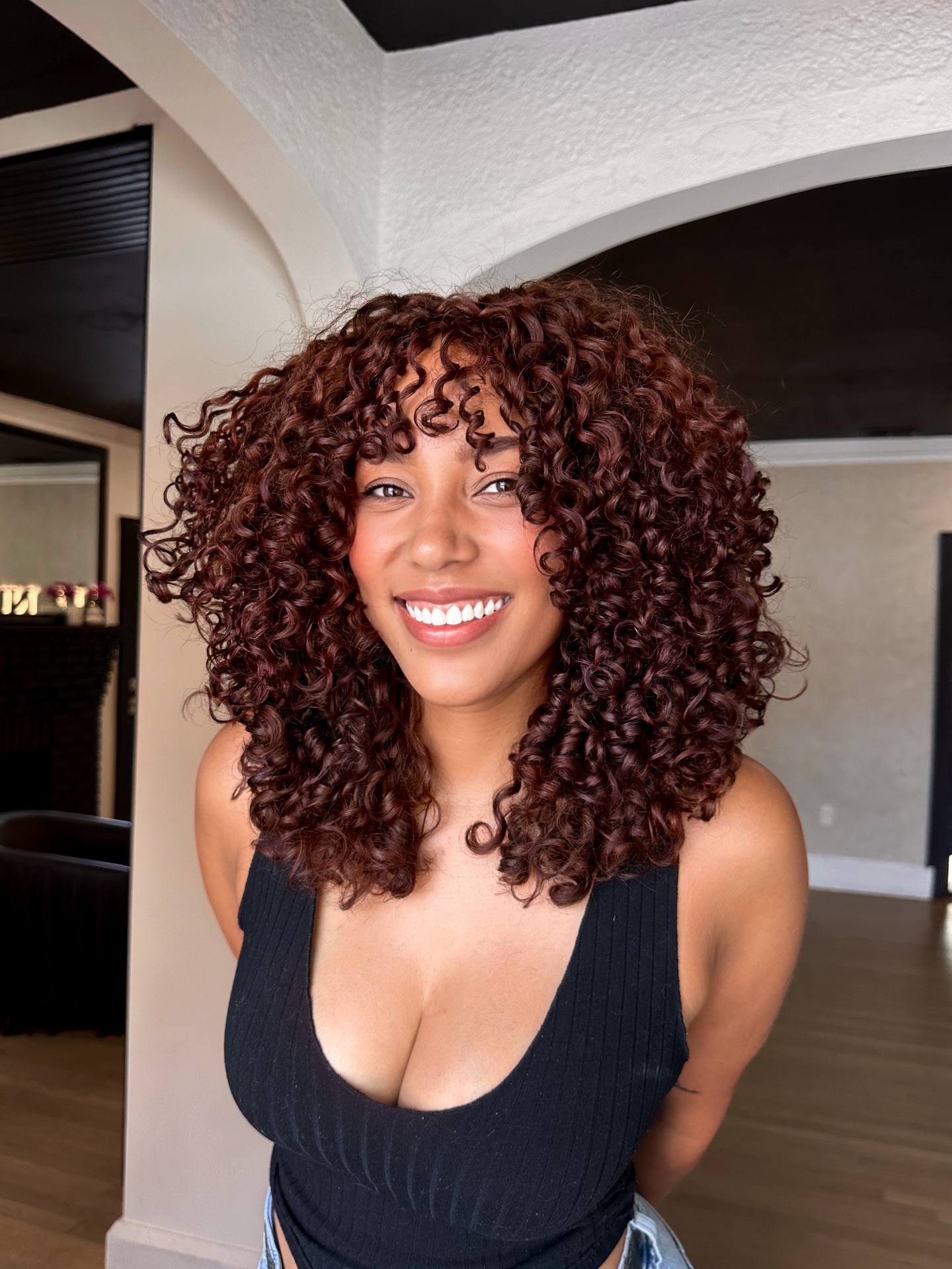 Vibrant Auburn Curly Shoulder-Length Cut