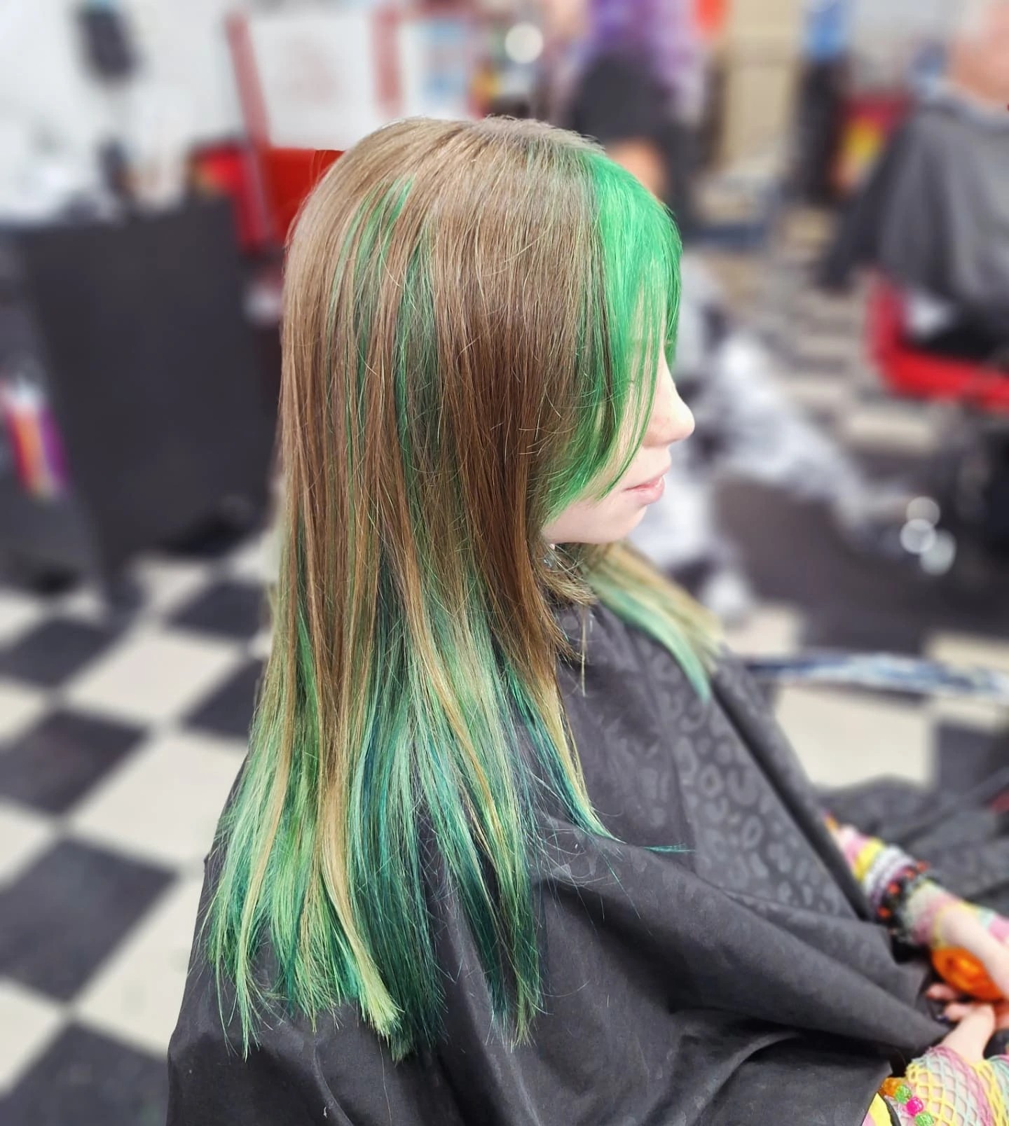 Vivid Green Peek-a-Boo Streaks on Straight Mid-Length Hair