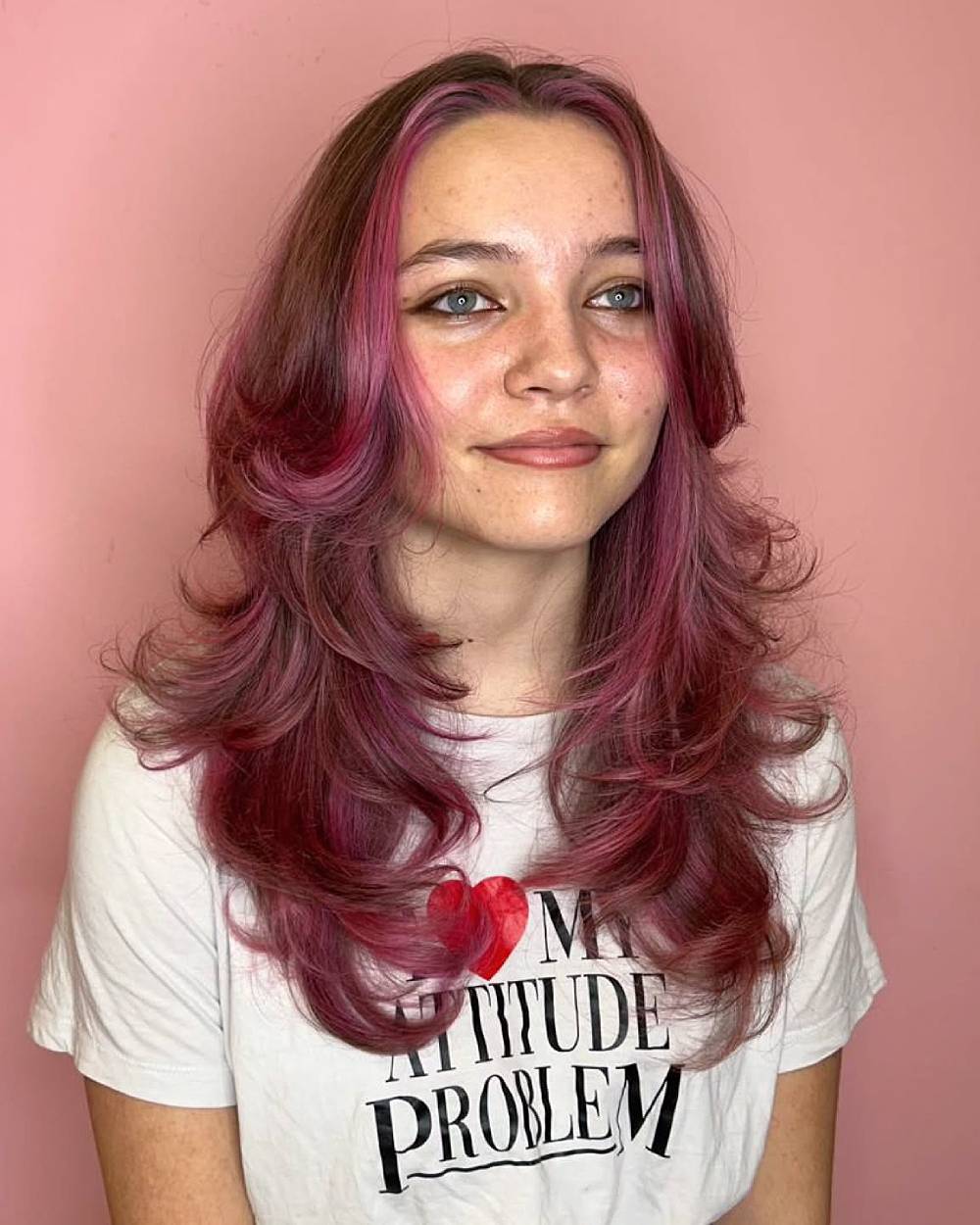 Whimsical Long Butterfly Cut with Playful Pink Highlights