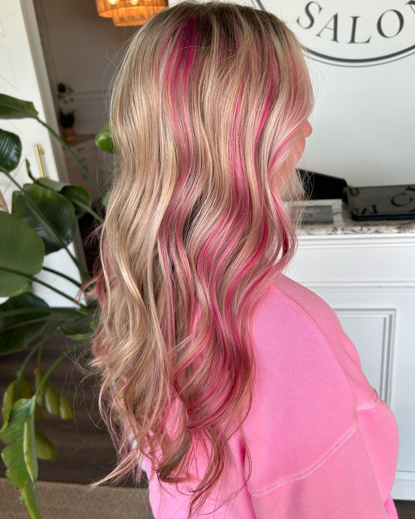 Bright Pink Streaks on Blonde Waves