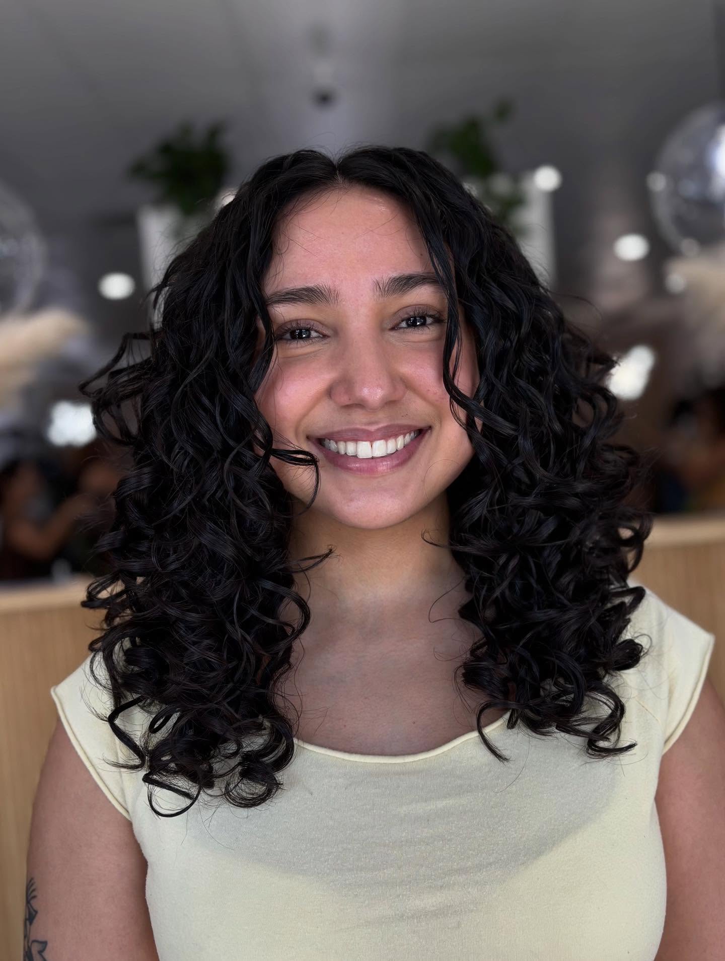 Deep Black Spiraled Shoulder-Grazing Curls