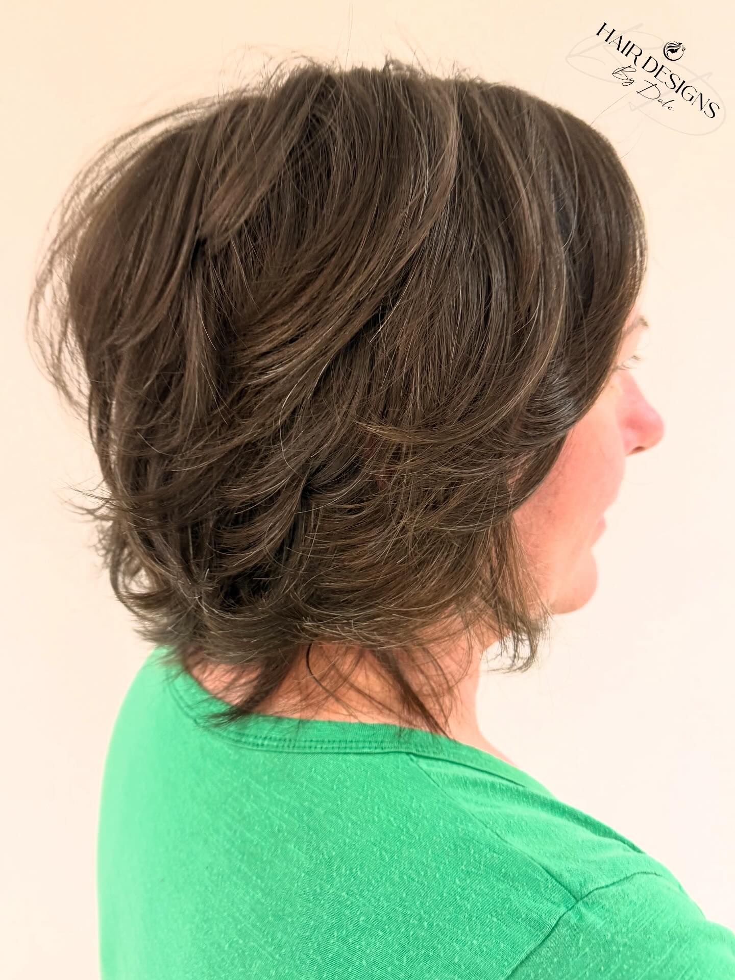 Dynamic Espresso Swirl Bob with Feathered Layers