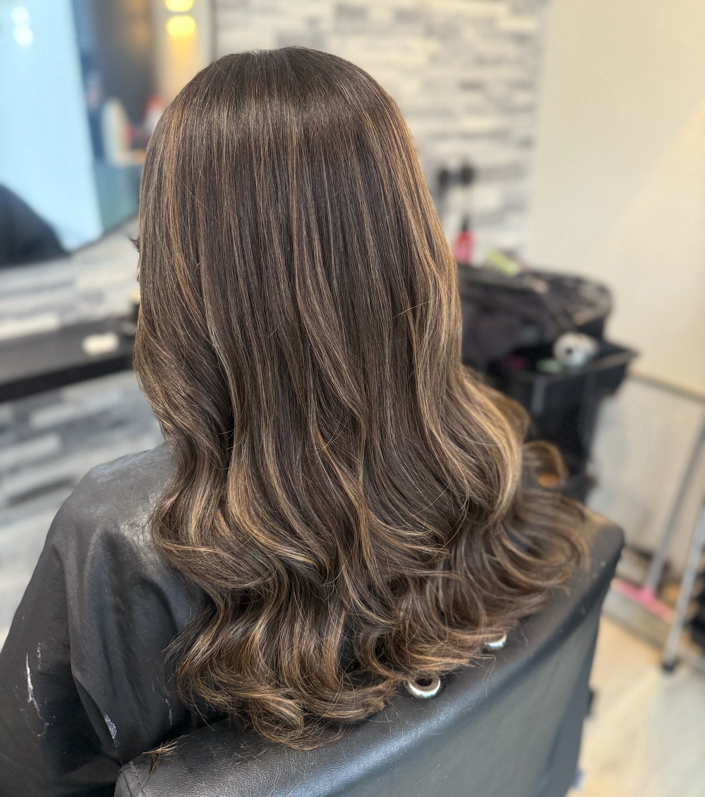 Luxurious Dark Brunette Balayage with Soft Waves