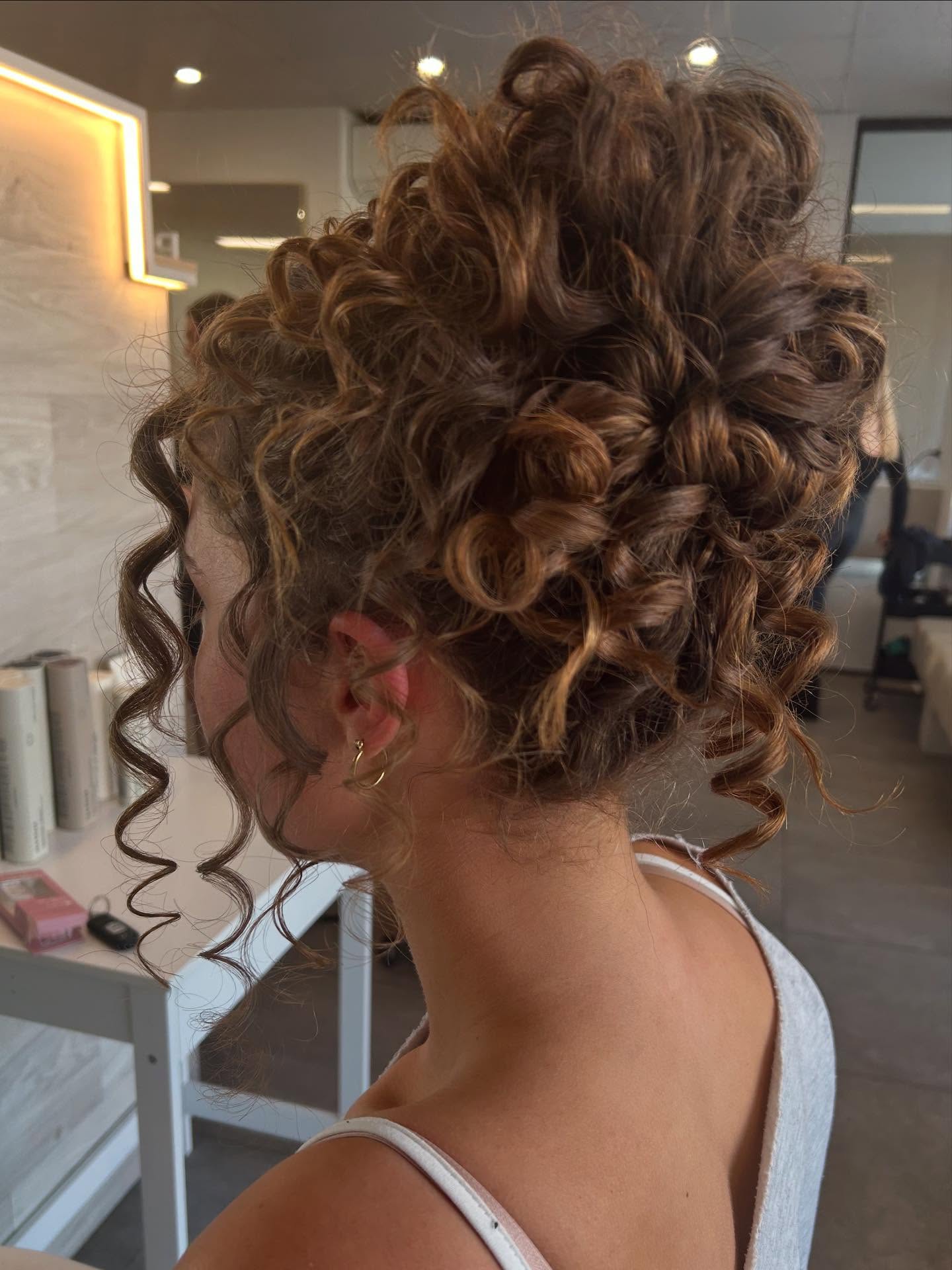 Luxurious Tightly Coiled Cinnamon Updo