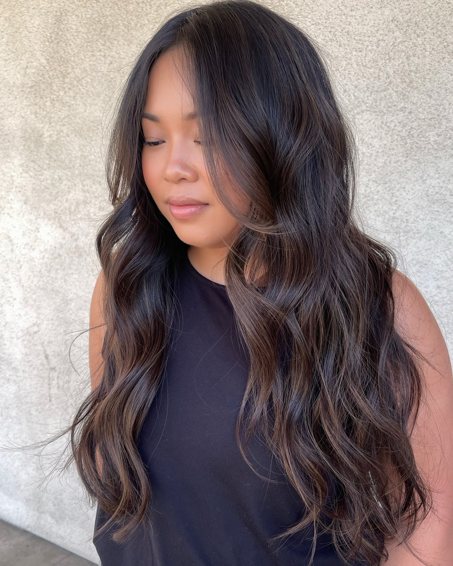 Softly Layered Dark Brunette Balayage with Loose Waves