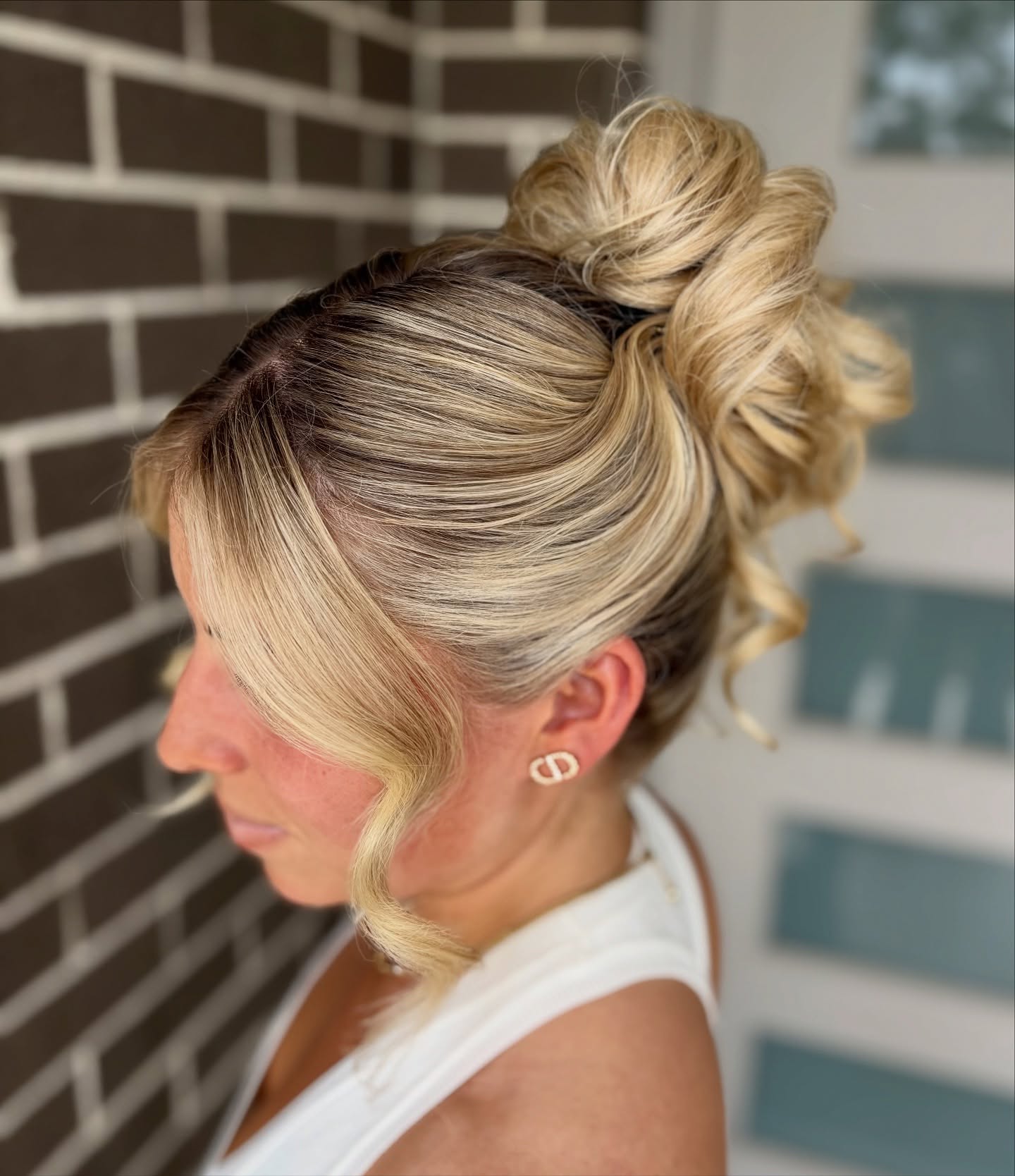 Cascading Blonde Textured Bun with Side Sweep