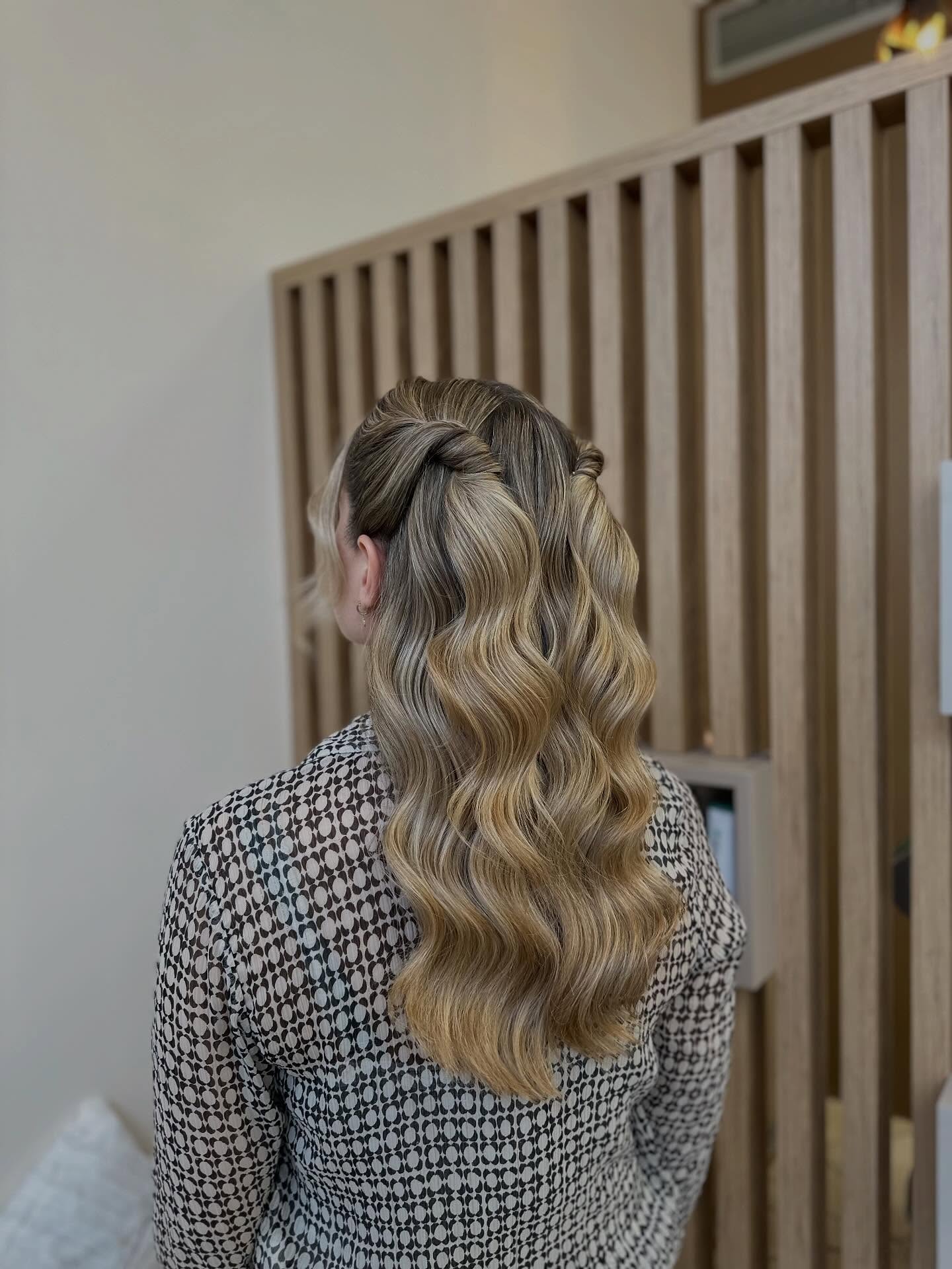 Chic Twisted Half-Up Waves with Glossy Finish