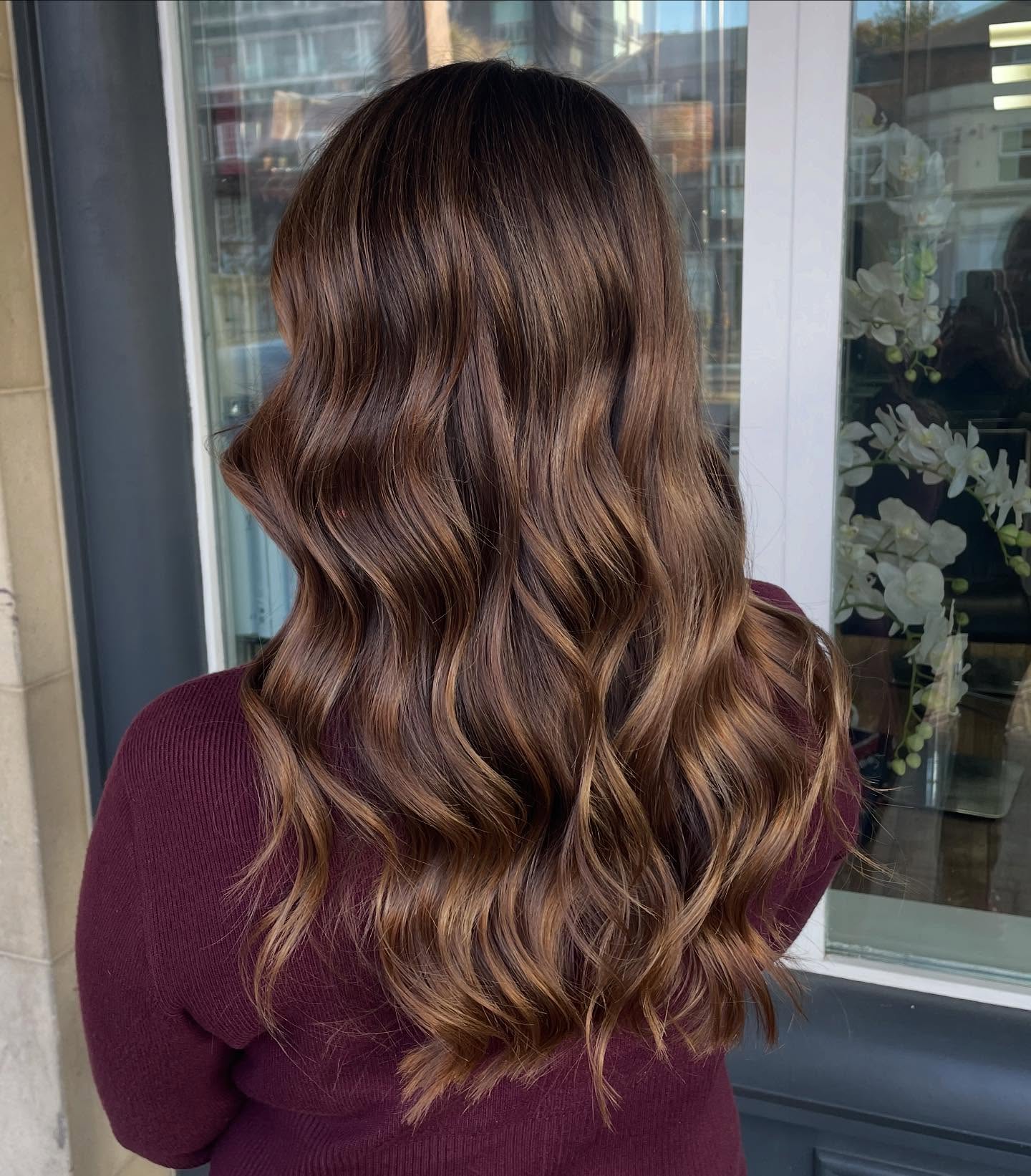 Radiant Caramel Balayage on Long, Wavy Hair