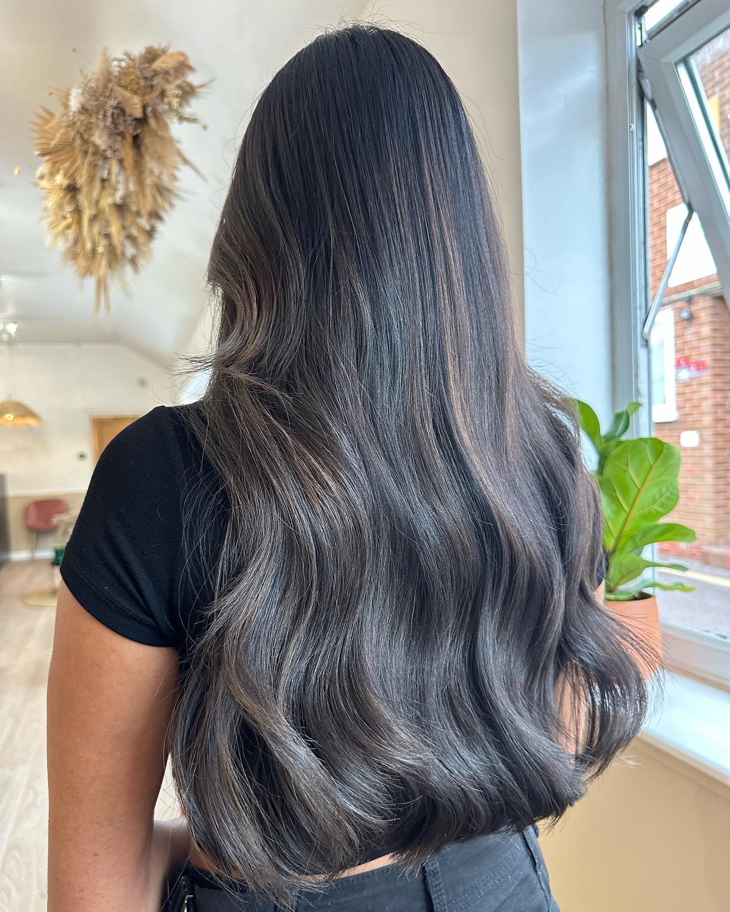 Sleek Dark Brown Balayage with Soft, Defined Waves