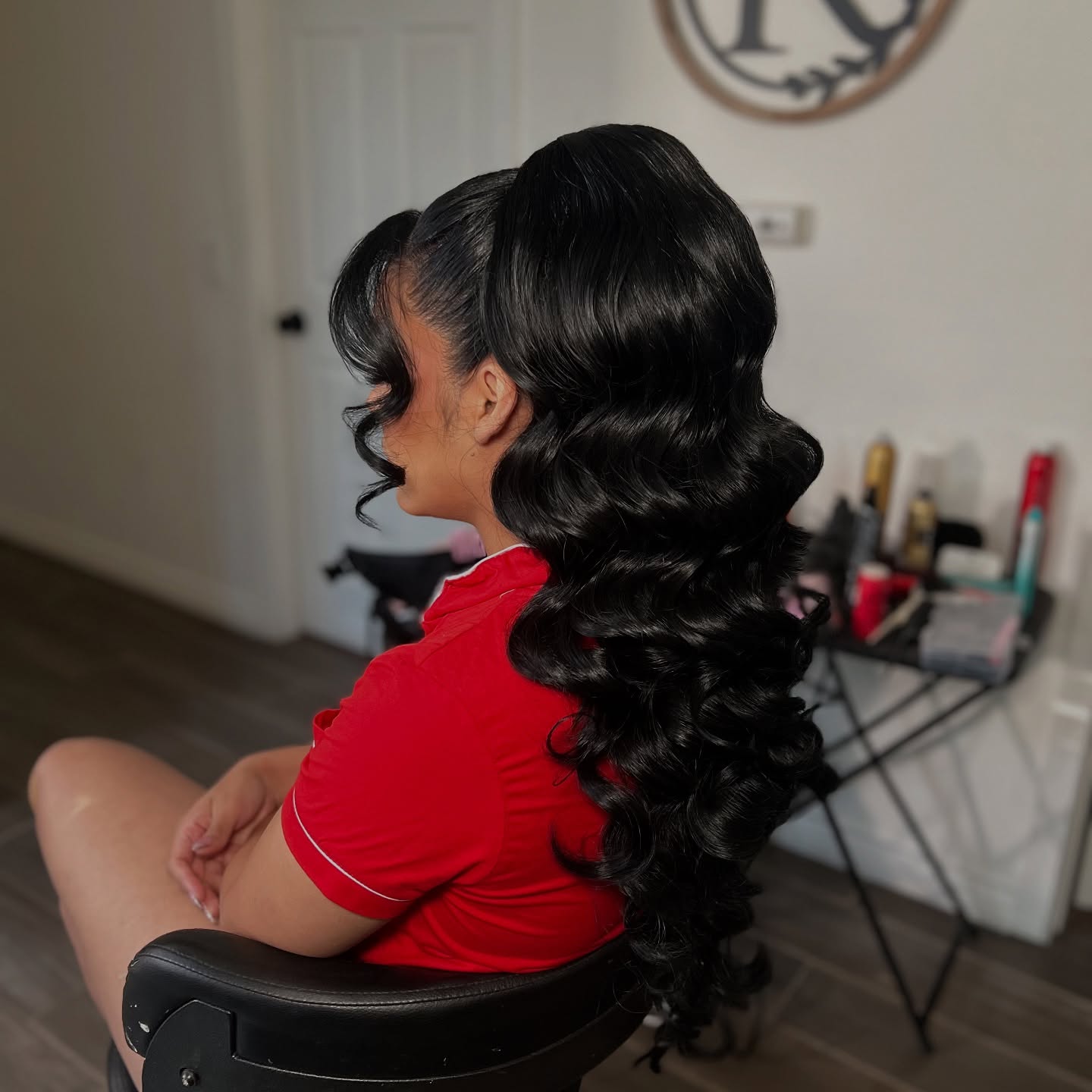 Sleek High Ponytail with Glamorous Cascading Curls