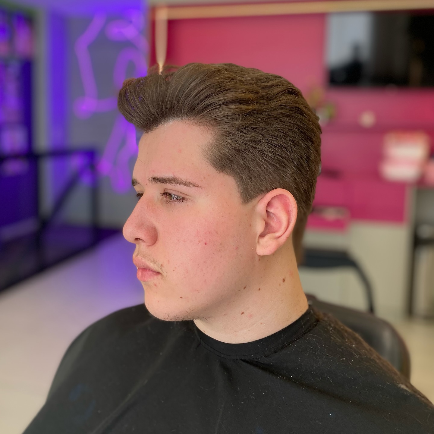 Sleek Voluminous Pompadour with Tapered Sides