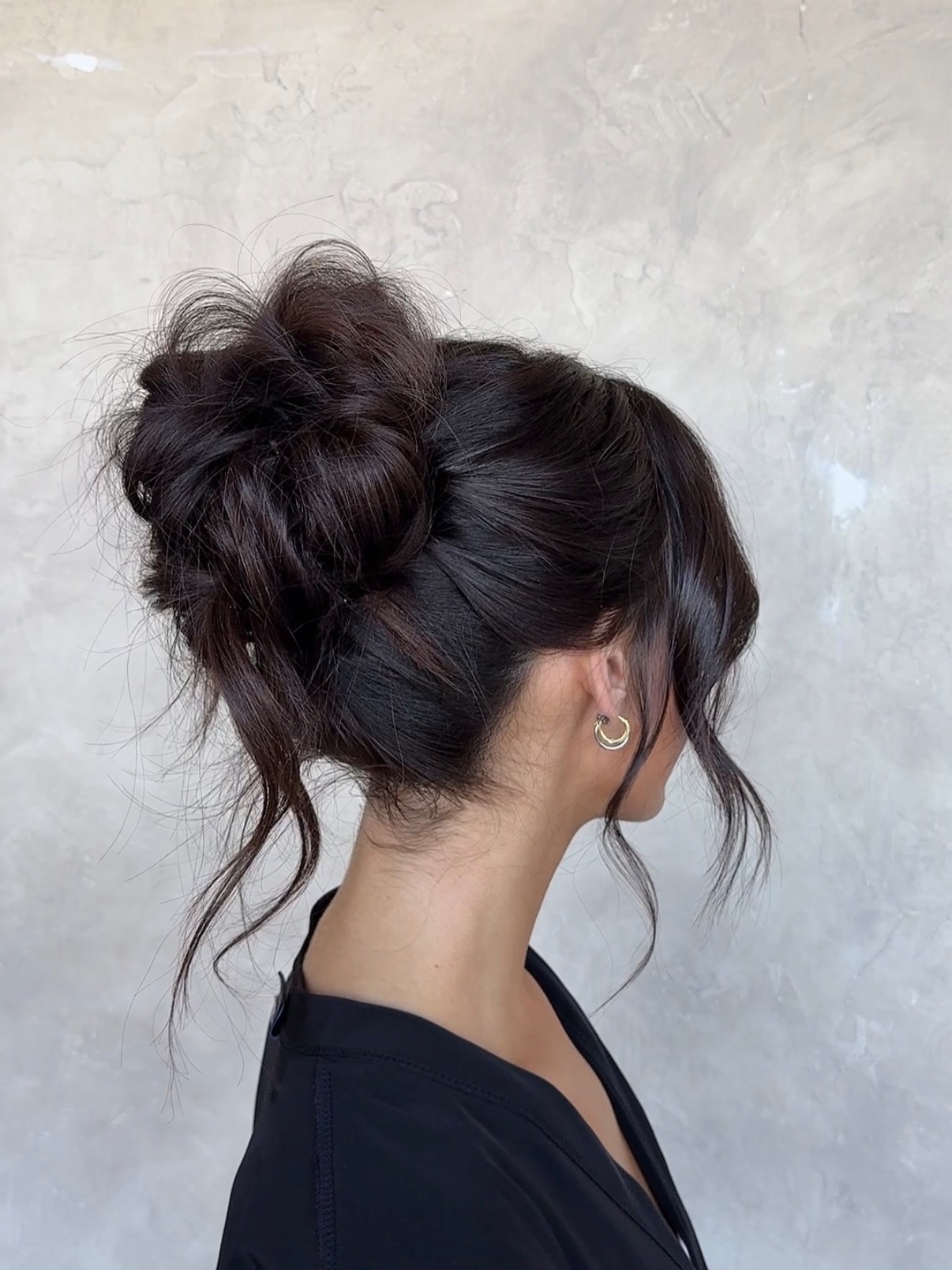 Textured High Bun with Soft Face-Framing Strands