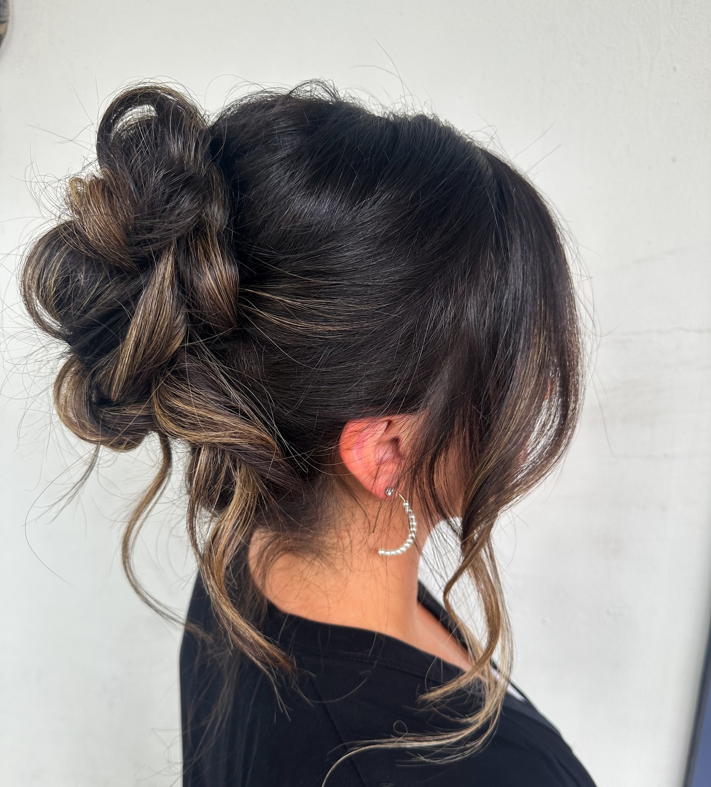 Textured Low Chignon with Face-Framing Strands