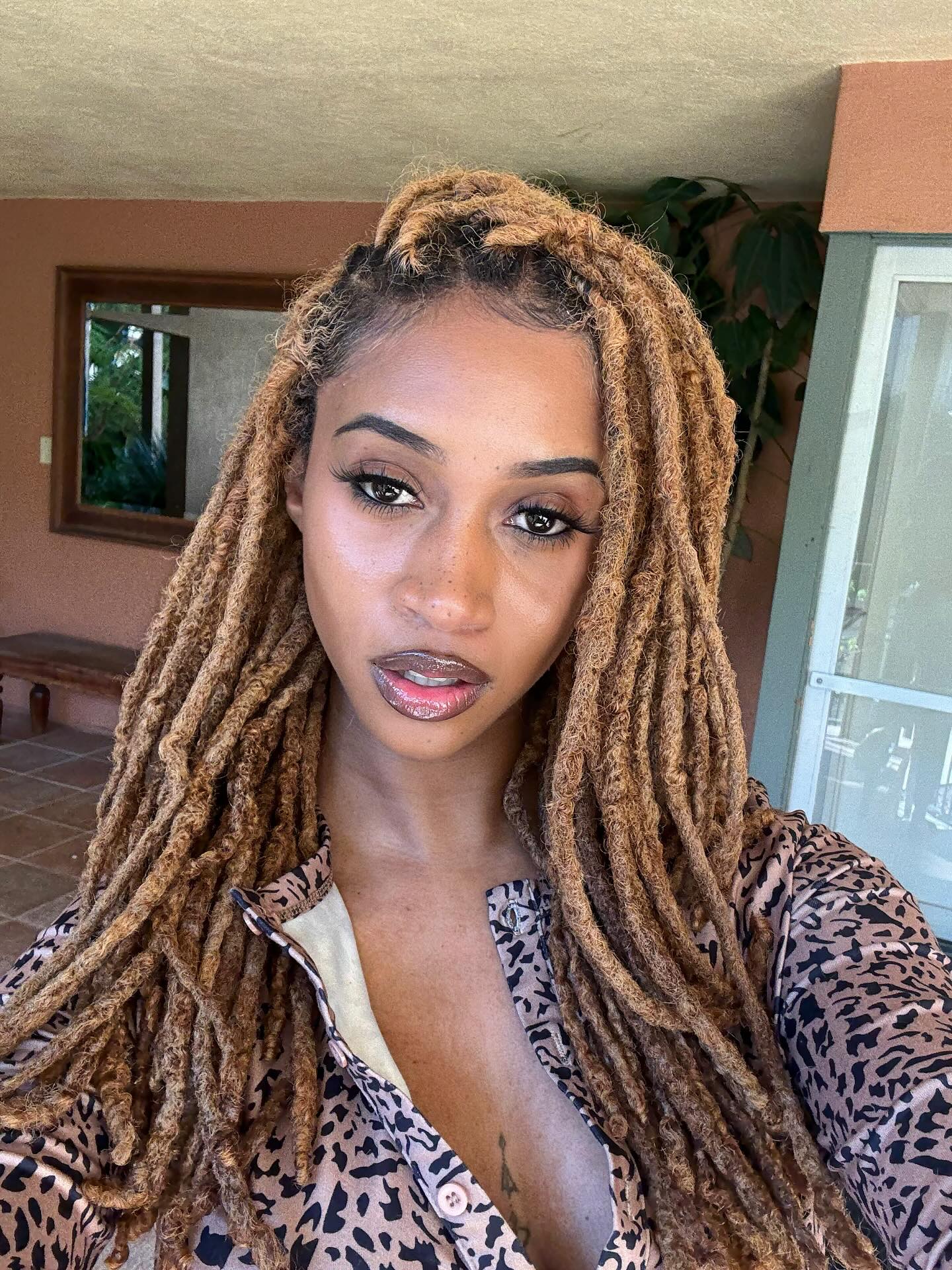 Textured Mid-Length Locs with Playful Highlights