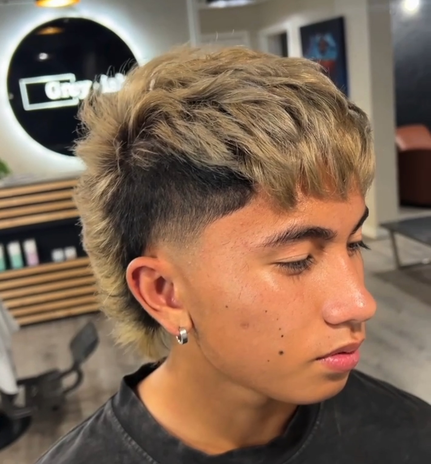 Textured Modern Mullet with Tapered Sides and Light Blonde Highlights