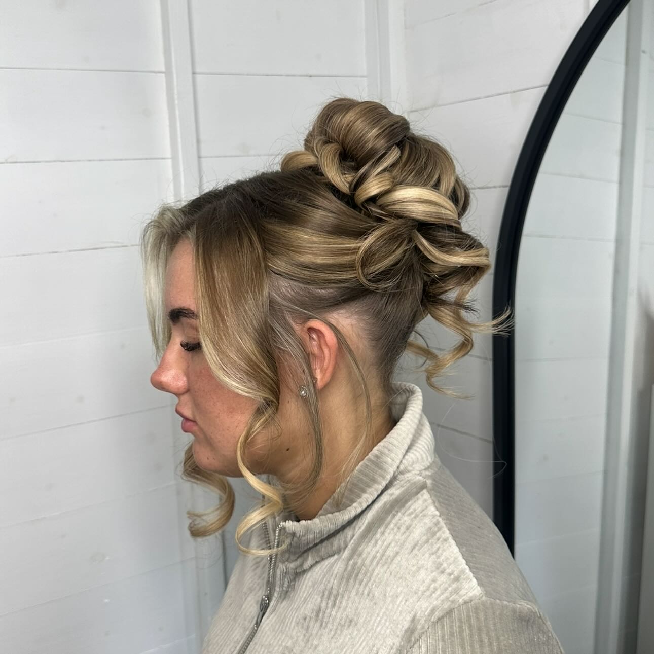 Twisted Blonde Updo with Loose Curls