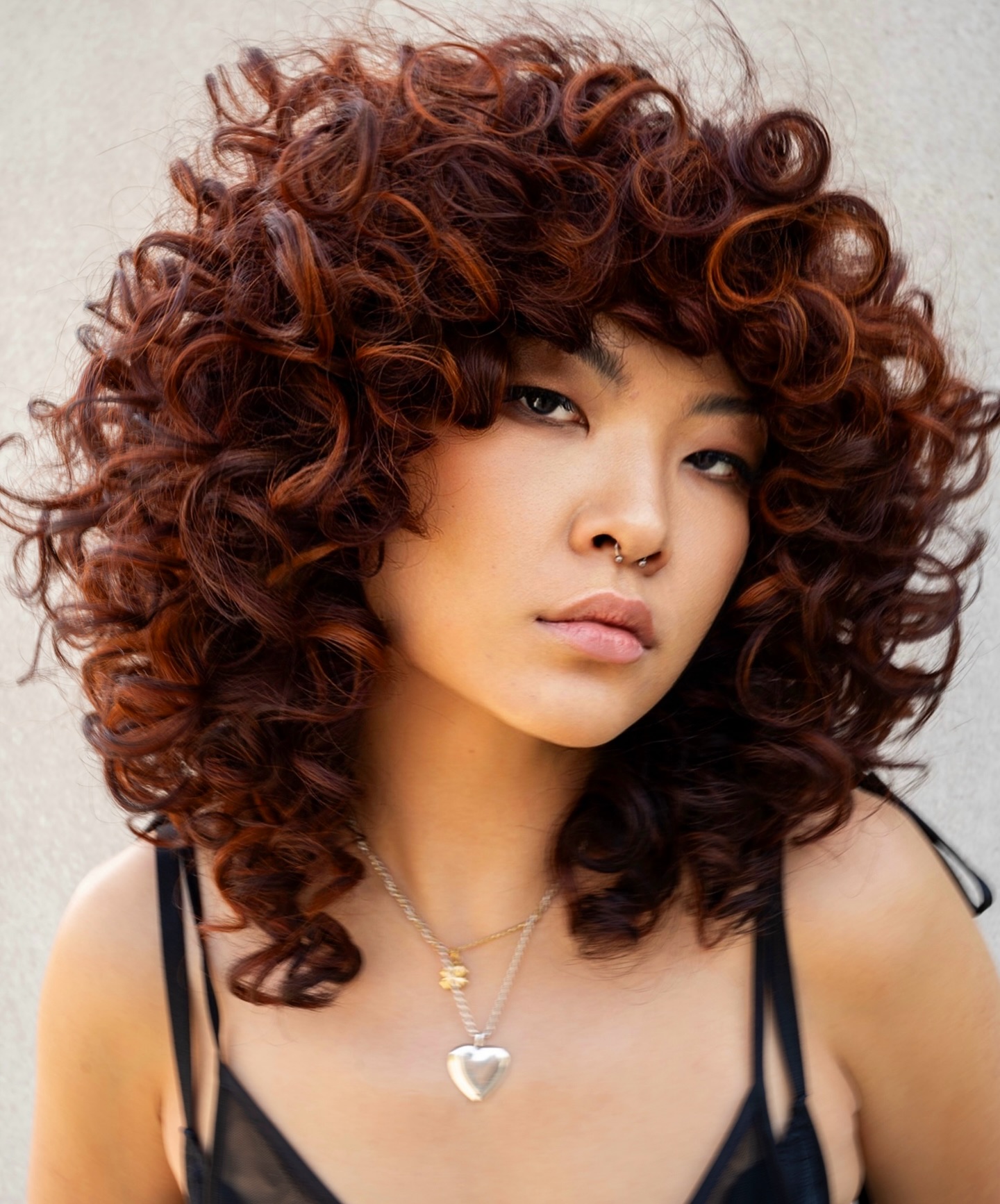 Vibrant Auburn Spiral Curls with Natural Volume