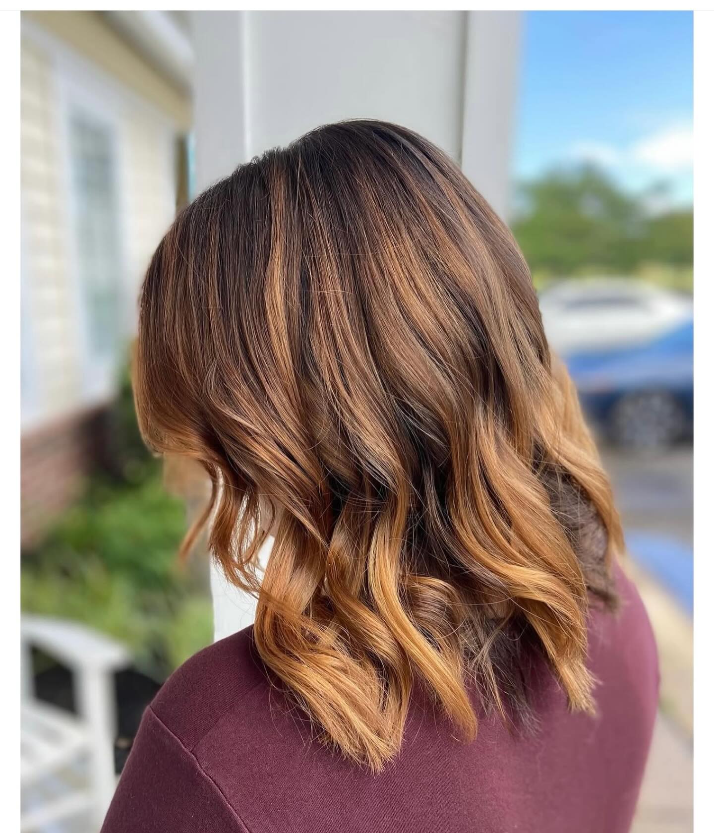 Warm Caramel Balayage on Textured Shoulder-Length Hair