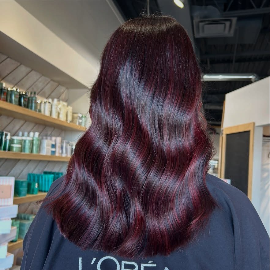 Bold Cherry Chocolate Balayage with Luxurious Waves