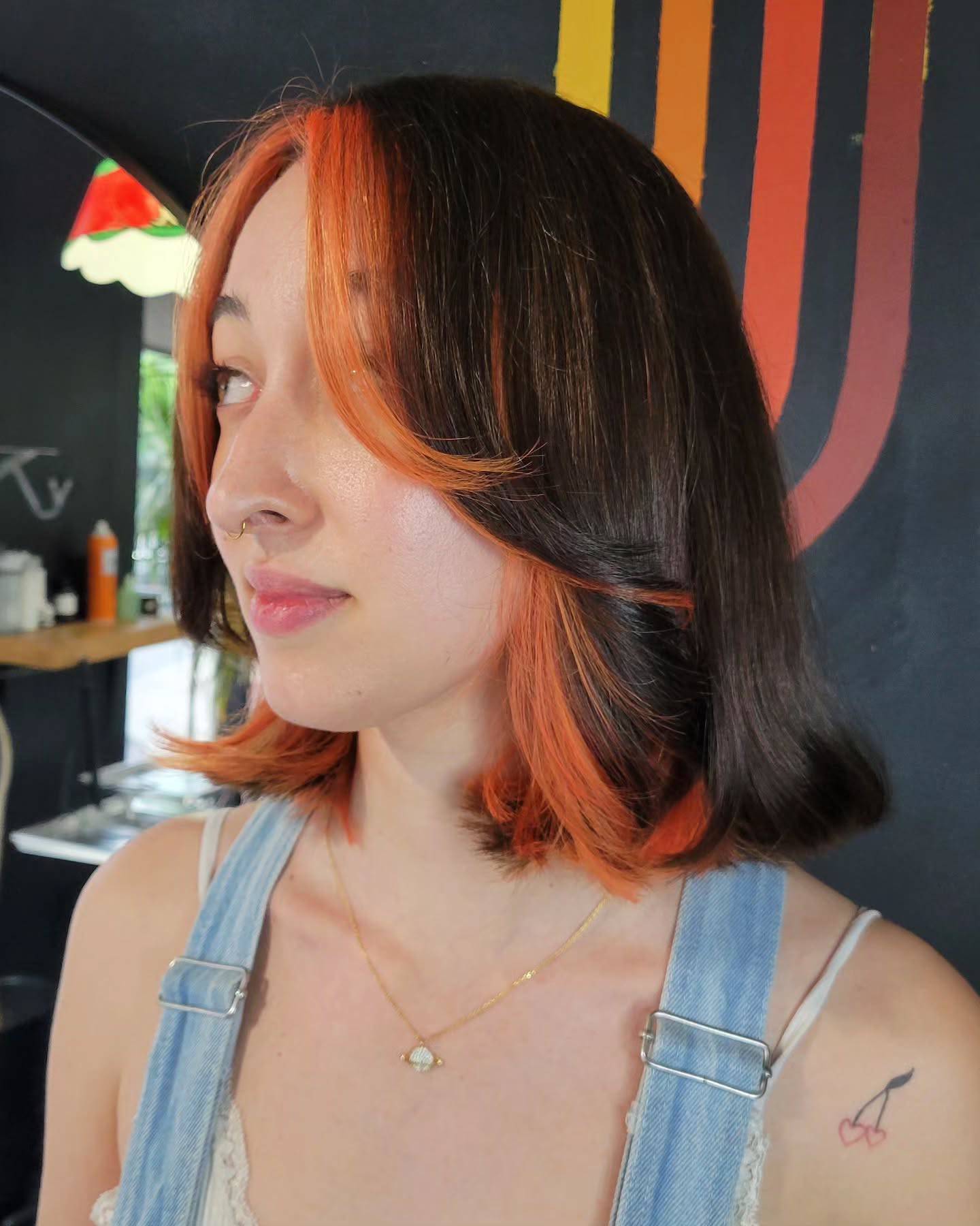 Chic Layered Bob with Fiery Orange Highlights