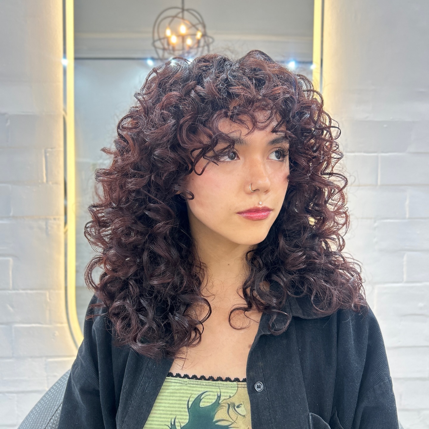 Dynamic Curly Wolfcut with Defined Layers