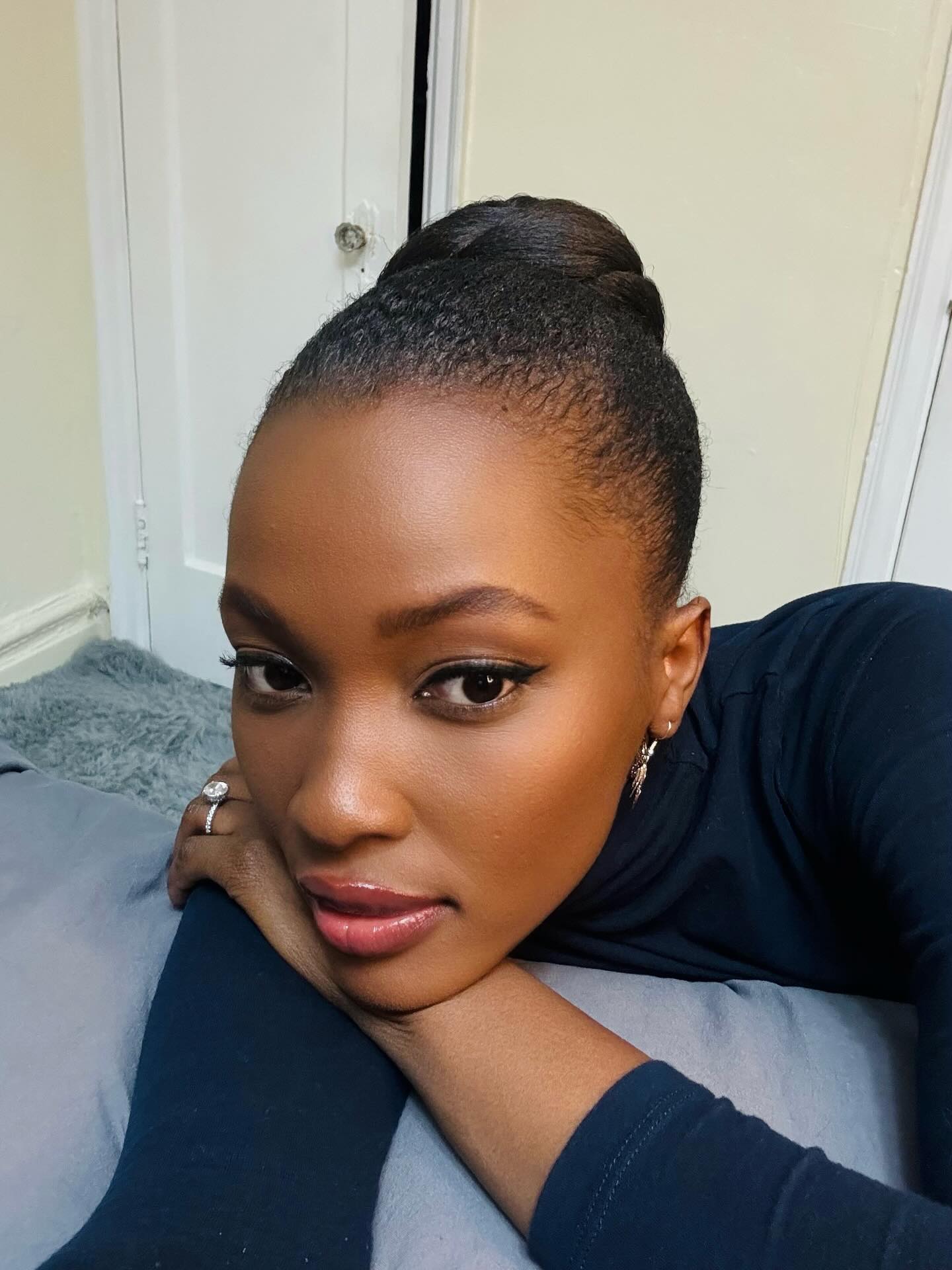Elegant Tightly-Pulled High Bun for Thick Textured Hair