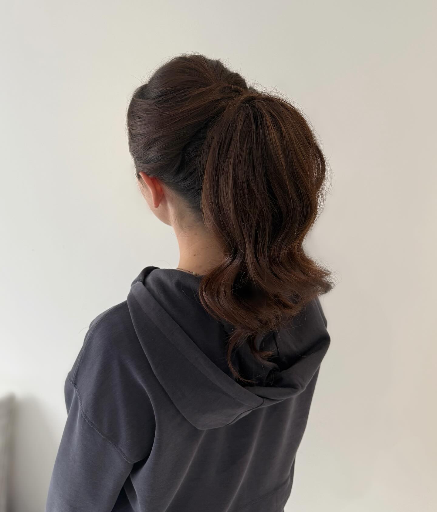 Elegant Tousled Ponytail with Soft Curls