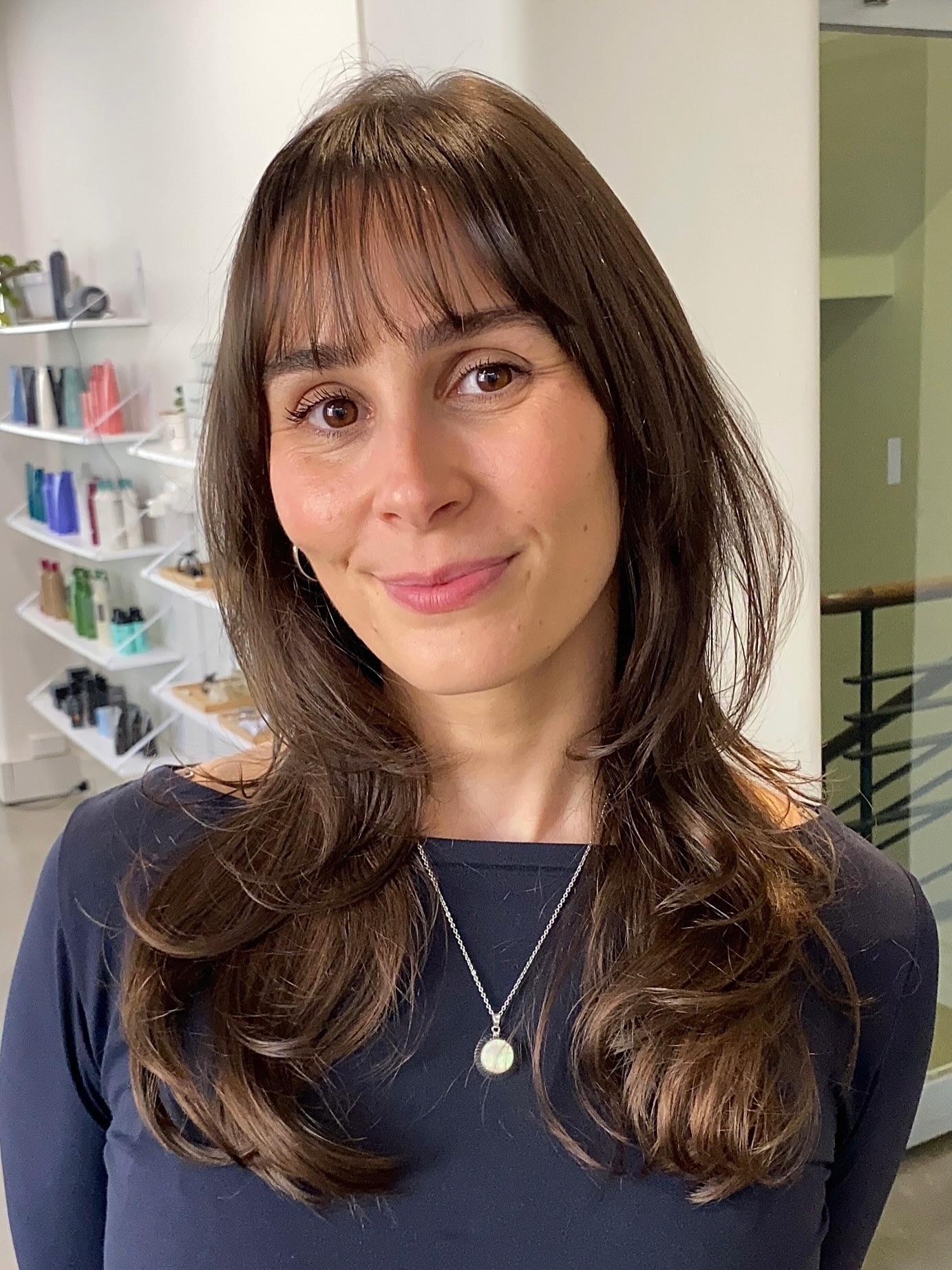 Layered Brunette Waves with Curtain Bangs