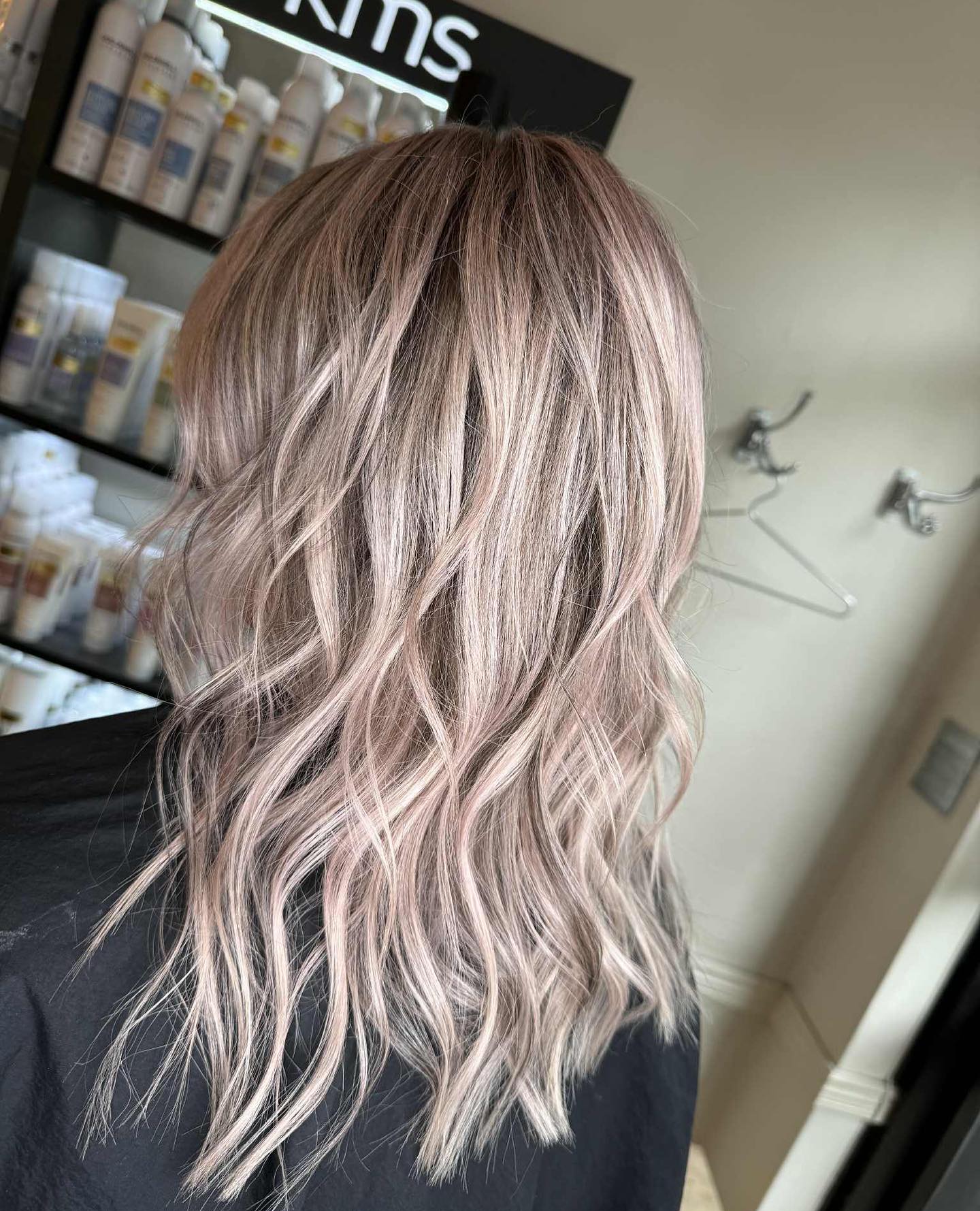 Mid-Length Ash Blonde Waves Accented with Delicate Pink Hues