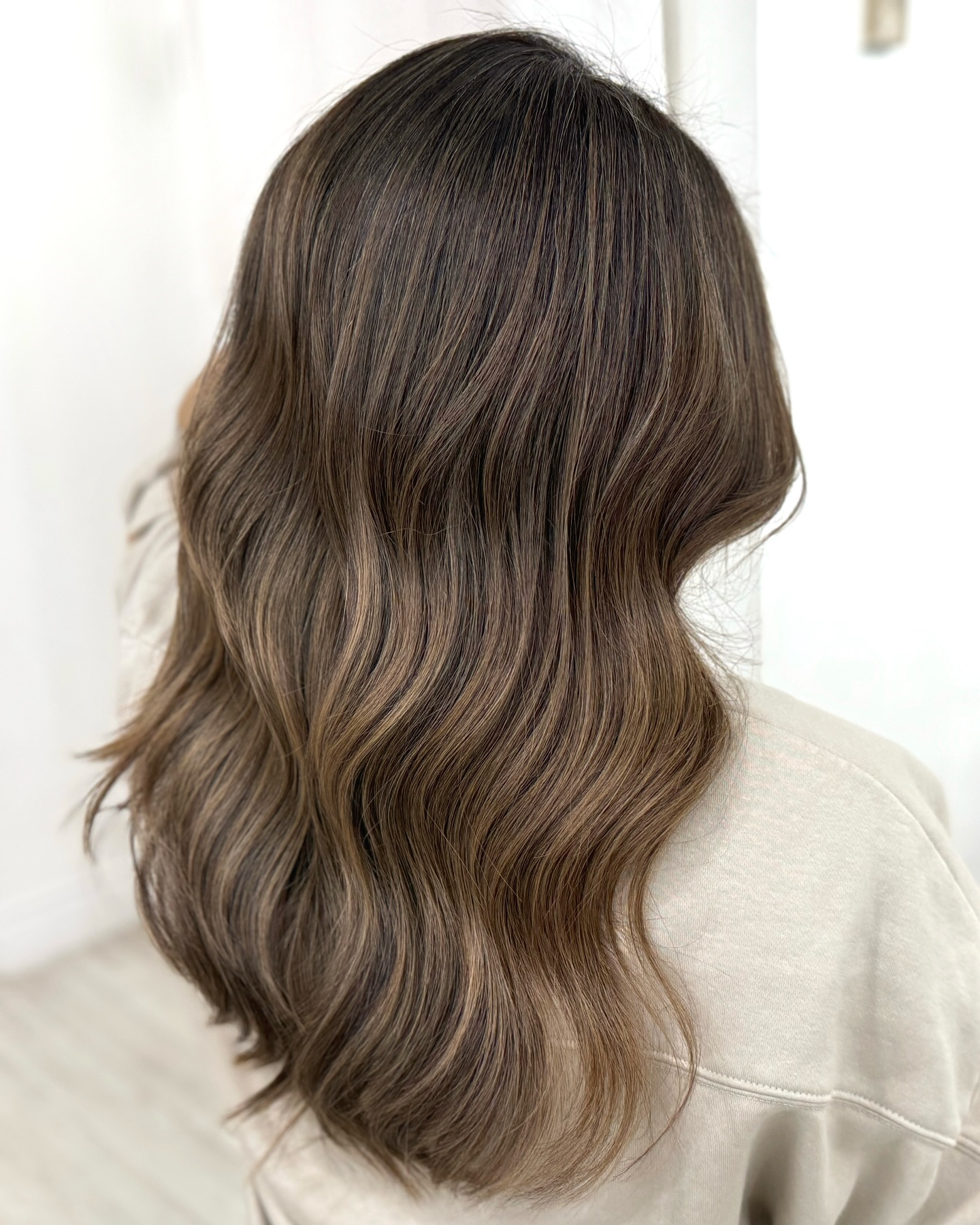 Natural-Looking Blonde Balayage on Long, Wavy Hair