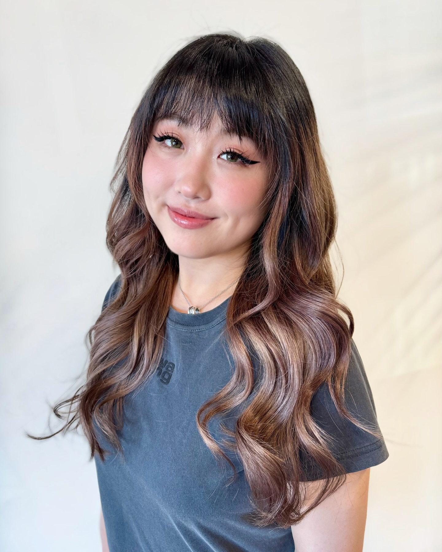 Radiant Chestnut Waves with Soft Curtain Bangs