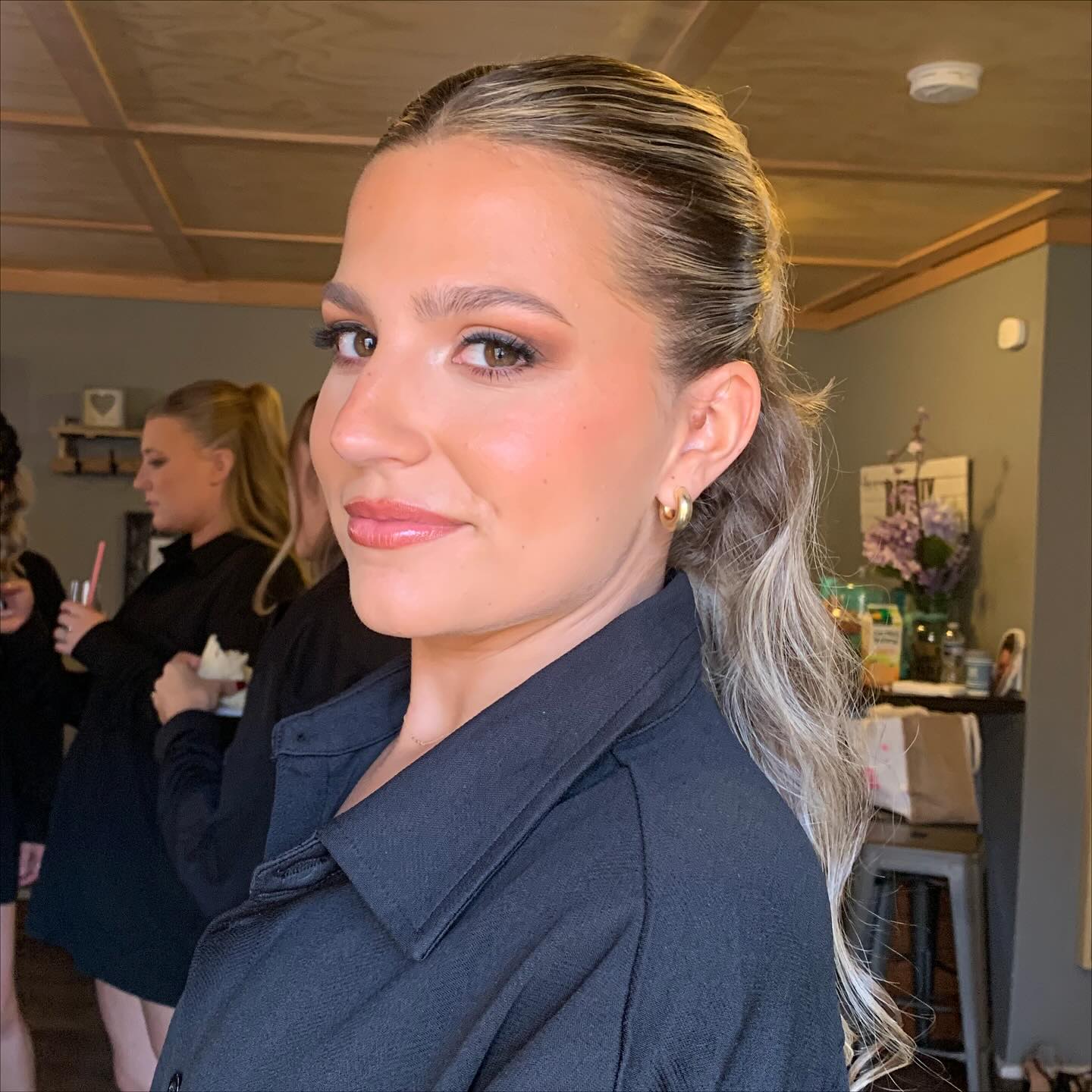 Refined Silver-Toned Slicked Ponytail with Subtle Waves