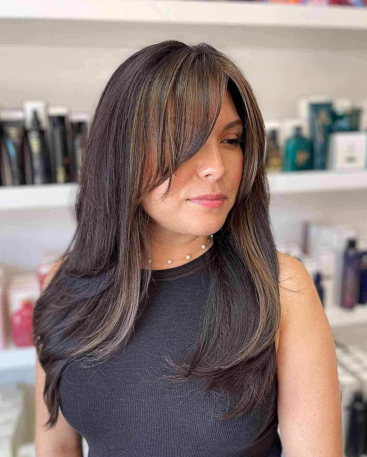 Soft Long Layers with Side Bangs for Round Faces