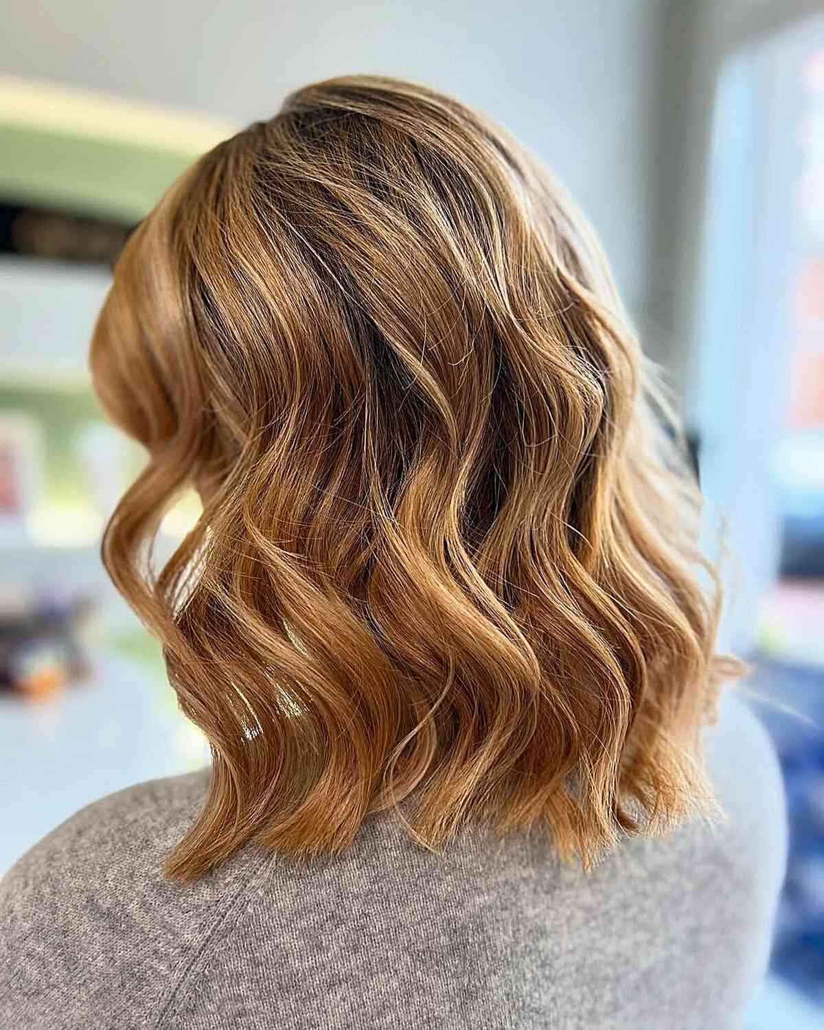 Soft Wavy Lob with Sun-Kissed Highlights