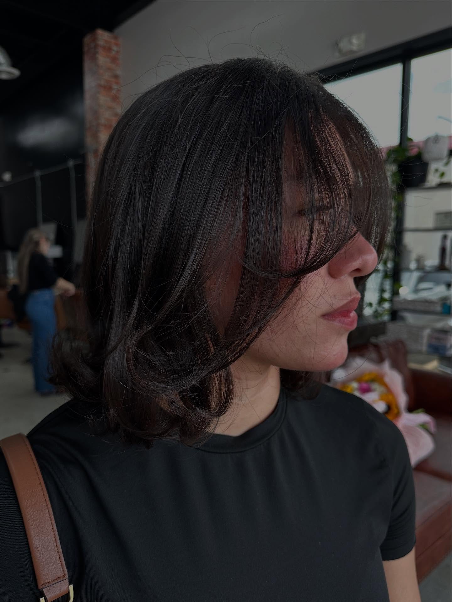 Softly Layered Shoulder-Length Cut with Face-Framing Bangs