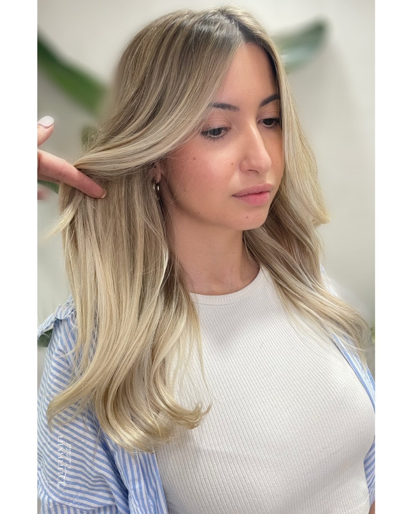 Subtle Balayage Highlights on Natural-Textured Long Blonde Hair