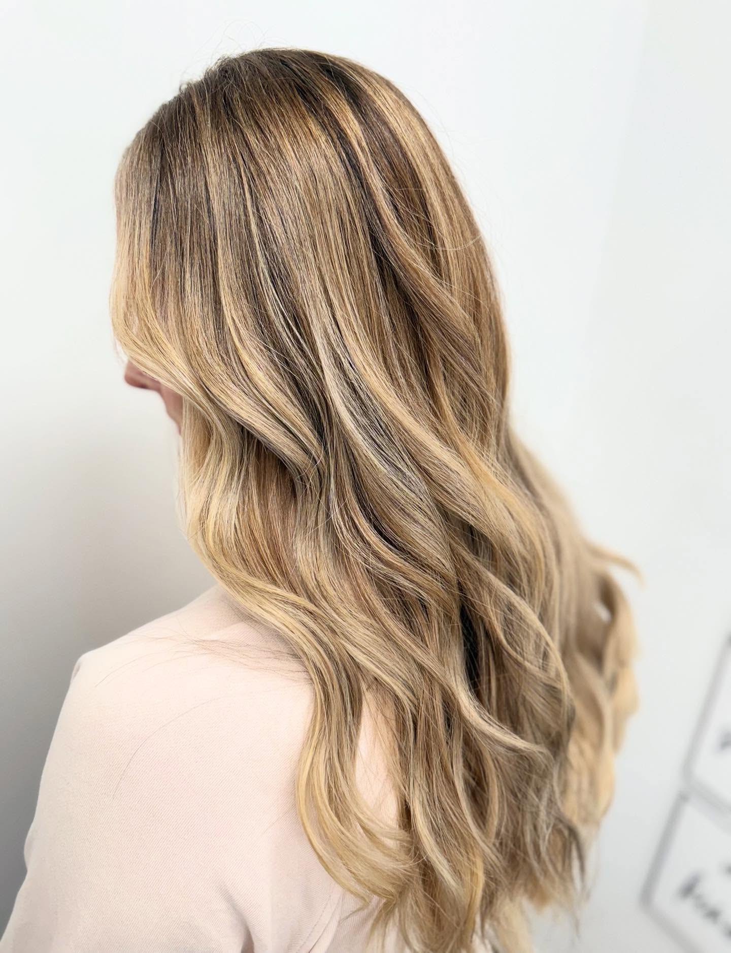 Warm Brunette Waves with Luminous Highlights
