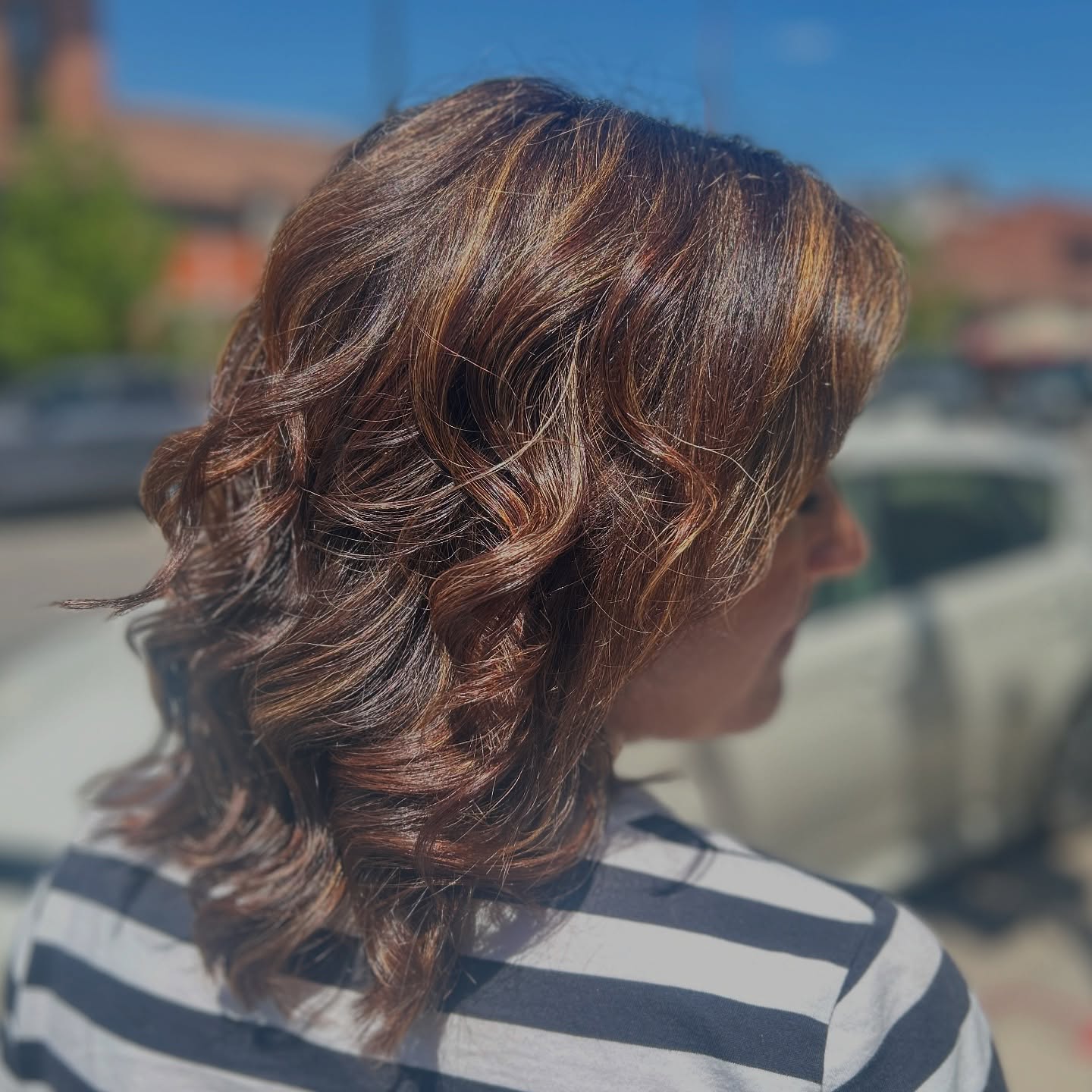 Warm Brunette Waves with Subtle Golden Highlights