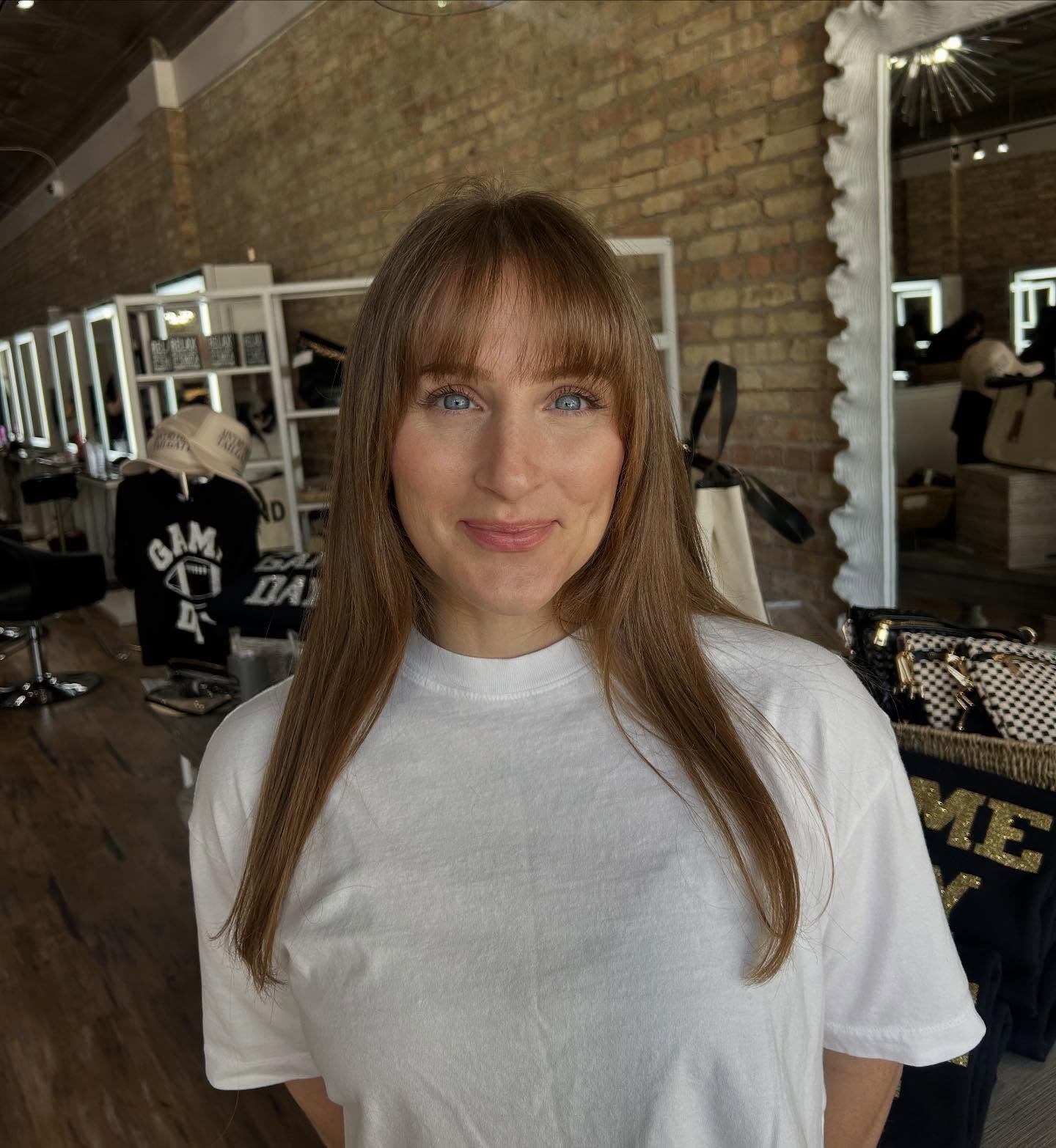 Caramel Blonde Straight Cut with Feathered Bangs
