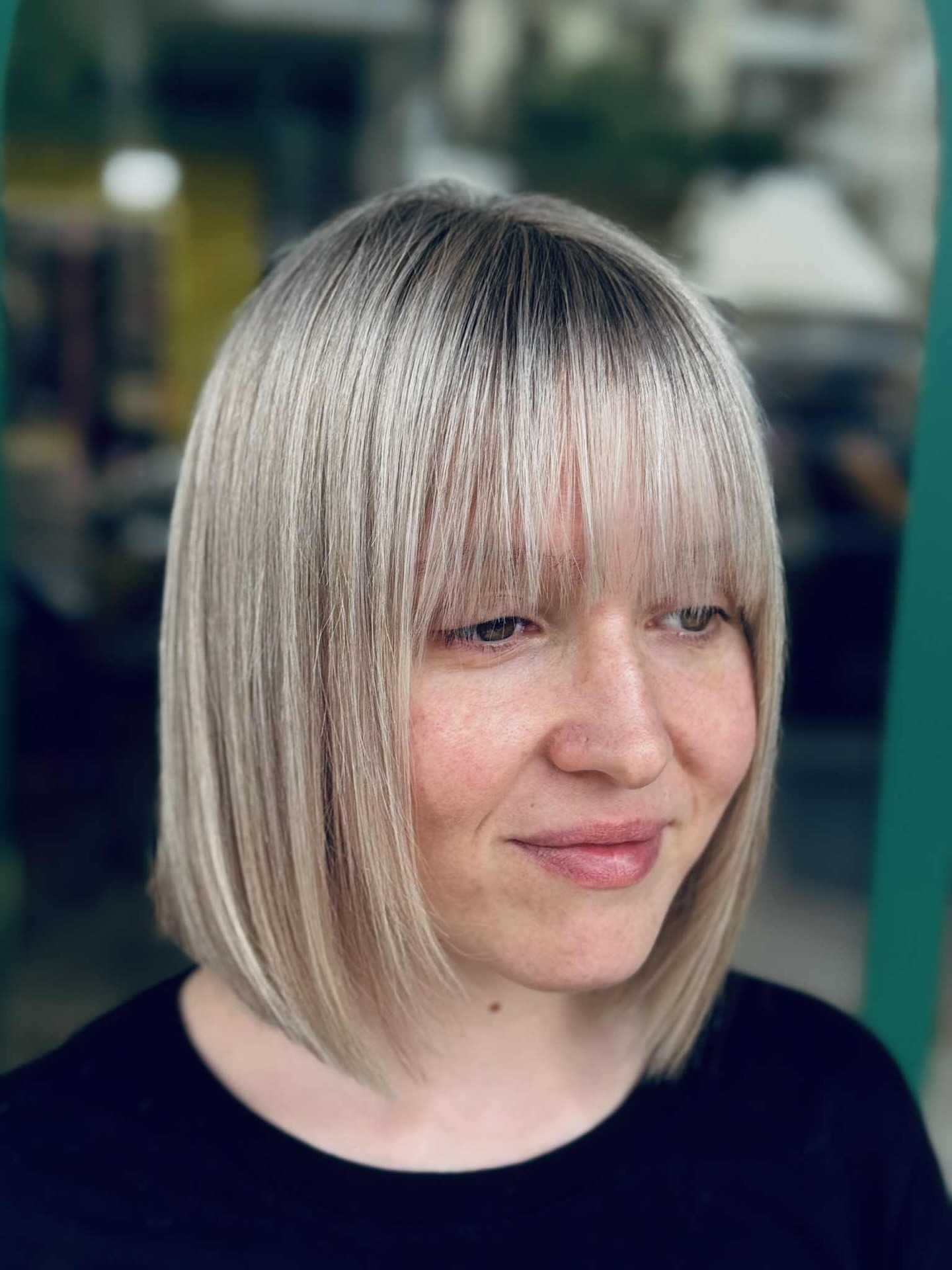 Chic Silver-Blonde Bob with Bangs and Dimensional Tones