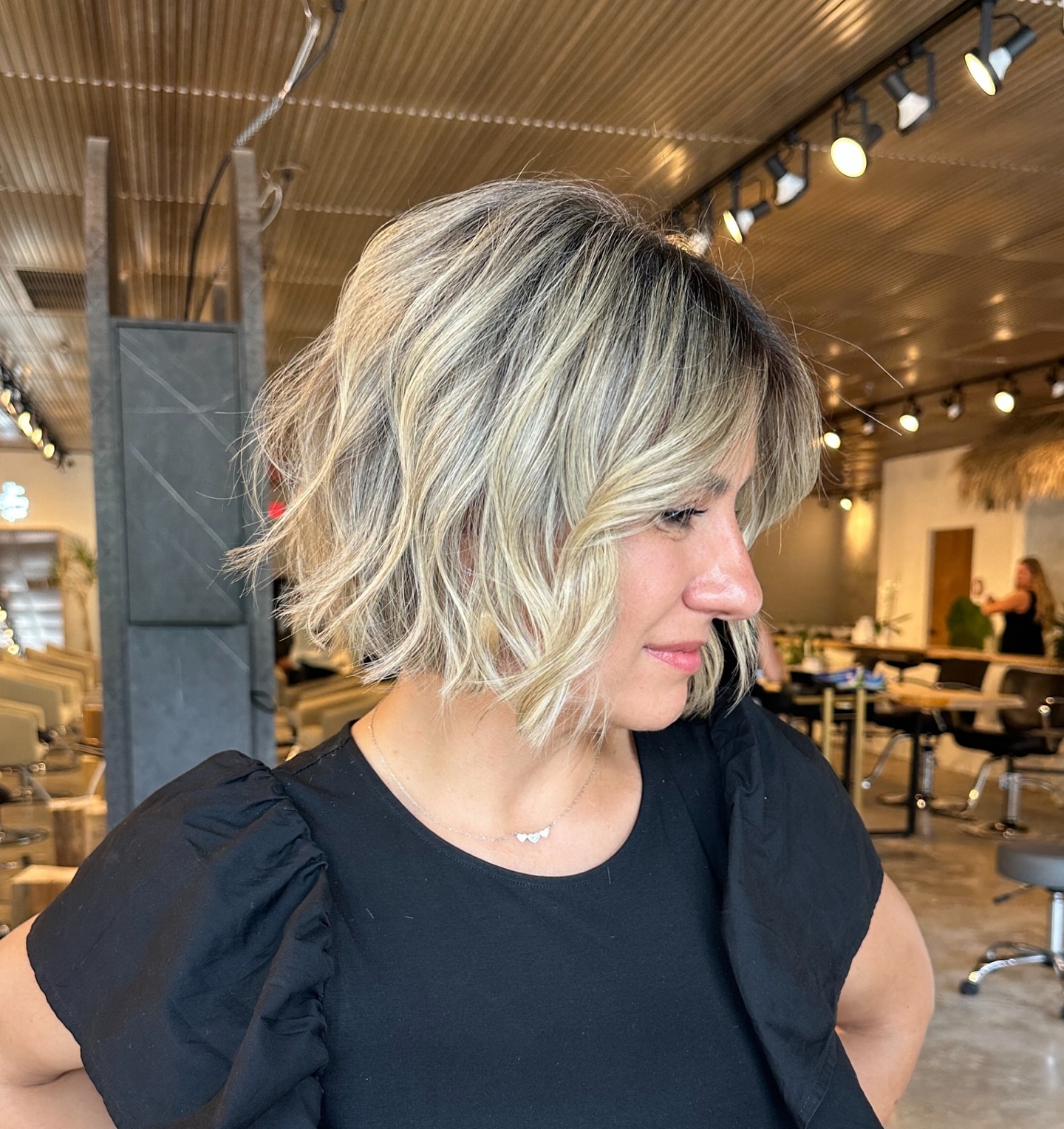 Dynamic Blonde Bob with Soft Contrasting Roots