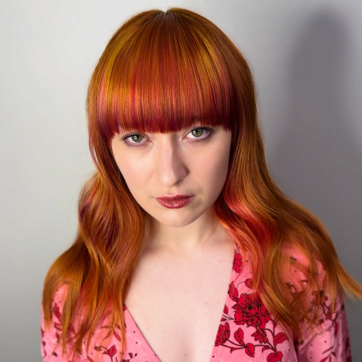Flame-Inspired Layered Bob with Fringe