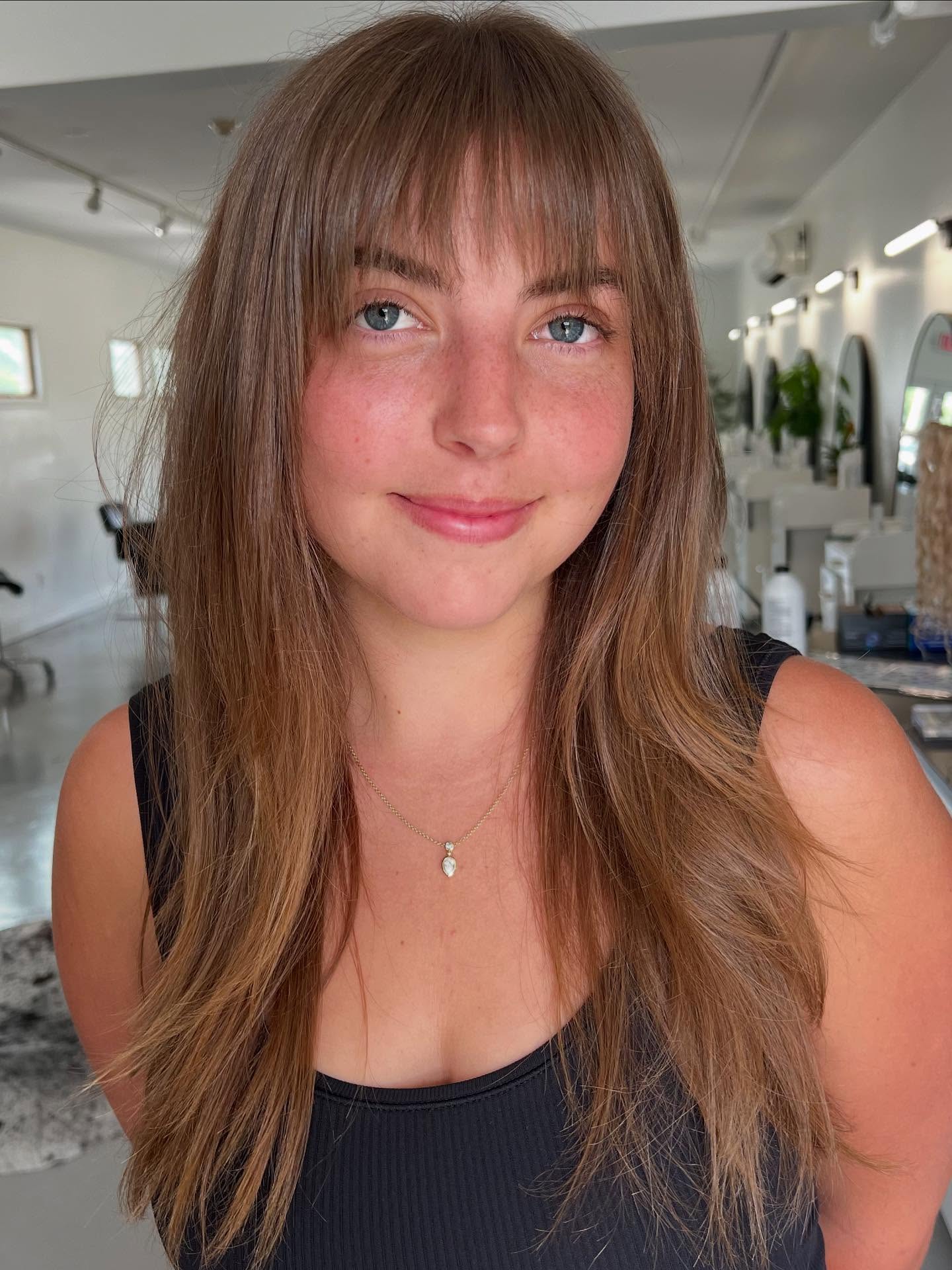 Long Tousled Brunette with Feathered Bangs